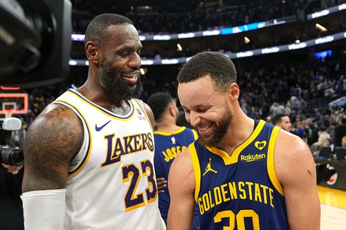 Forward LeBron James and guard Stephen Curry talk after a game at Chase Center. (Photo Credit: Imagn)