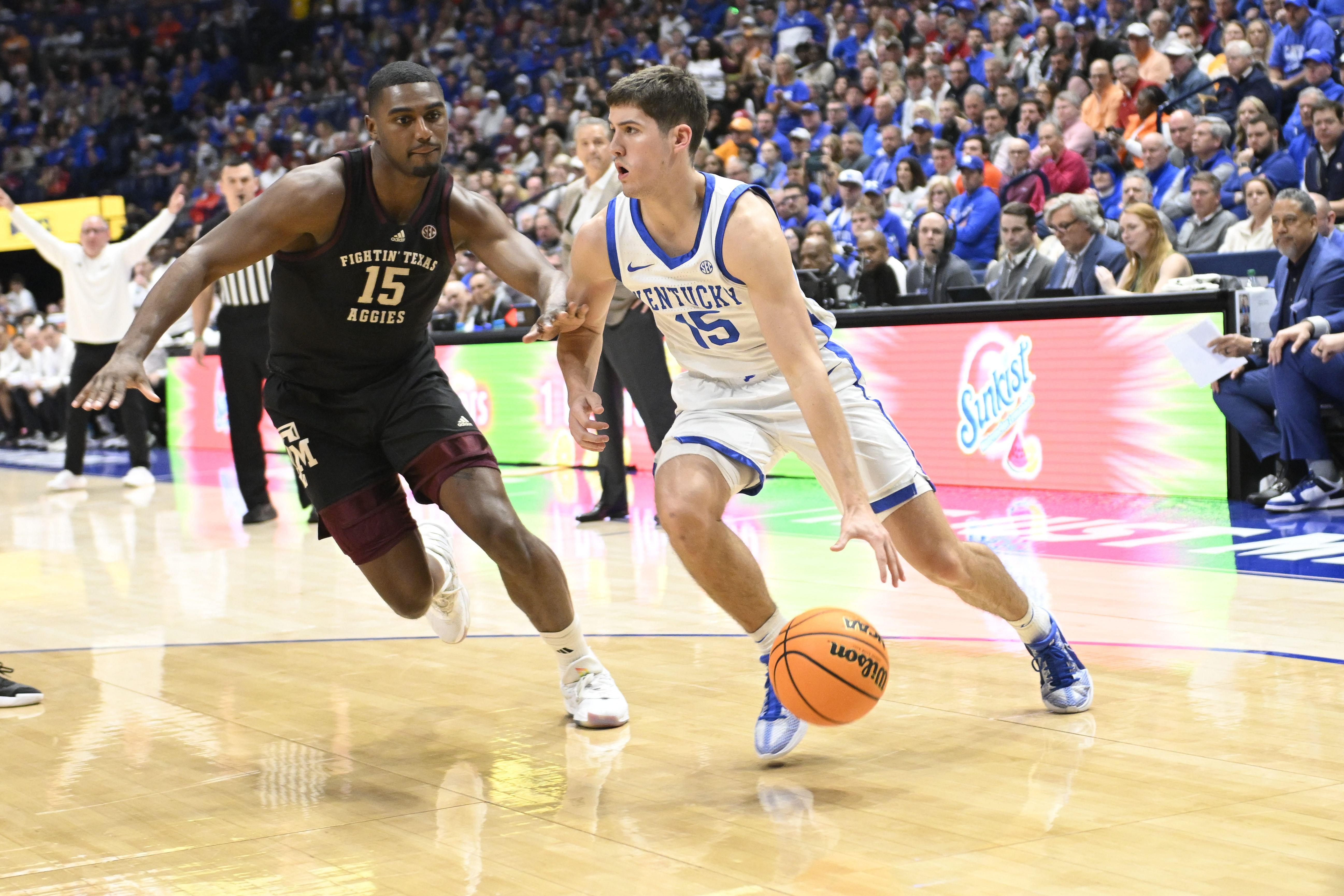 Kentucky Wildcats guard Reed Sheppard drives baseline past Texas A&amp;M Aggies forward Henry Coleman (Photo Credit: Imagn)