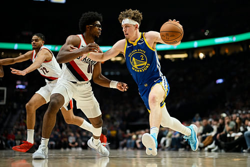 Golden State Warriors guard Brandin Podziemski drives to the basket during a game against Portland Trail Blazers. Photo Credit: Imagn