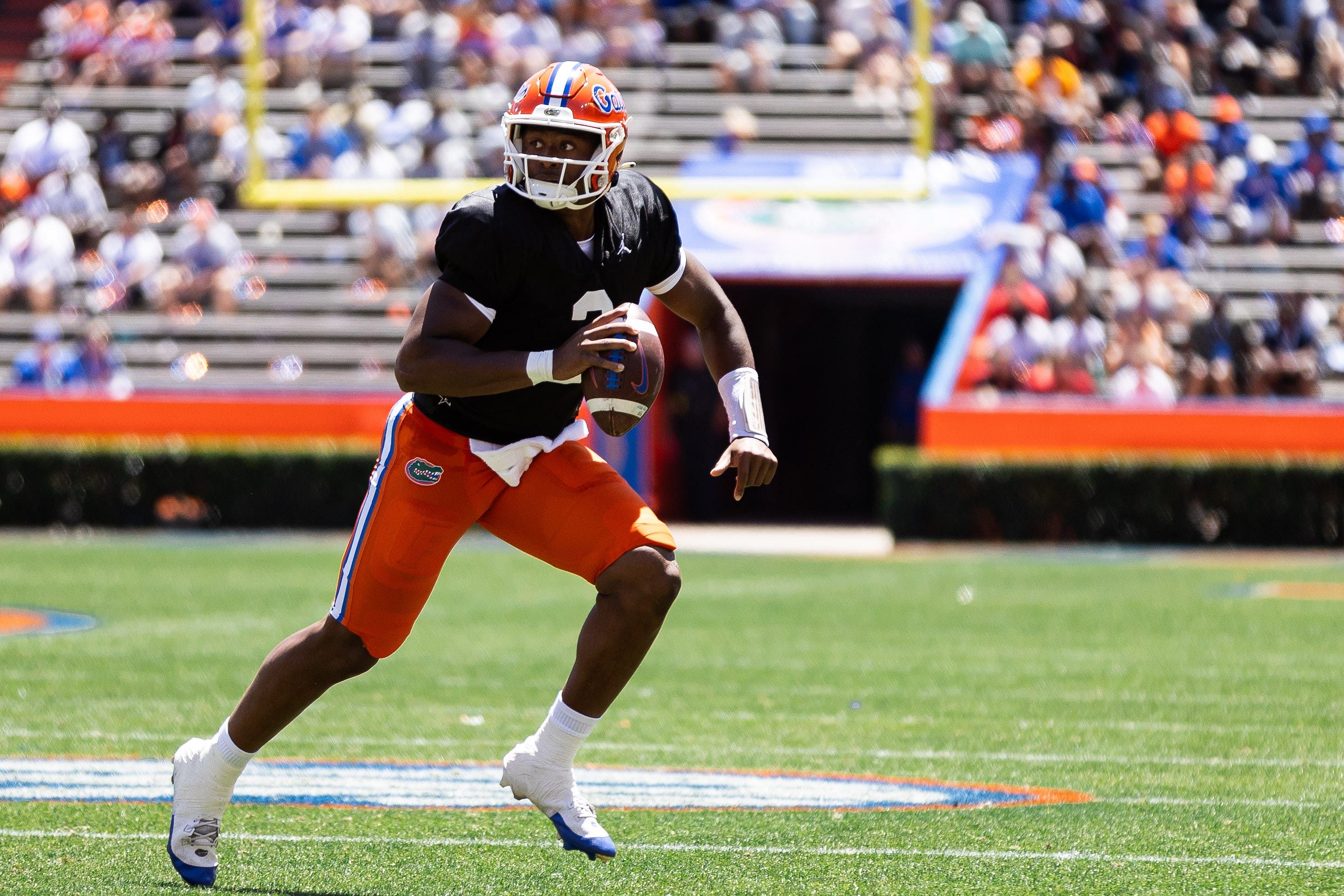 Florida Gators quarterback DJ Lagway (2) scrambles with the ball. (Image credit: Imagn)