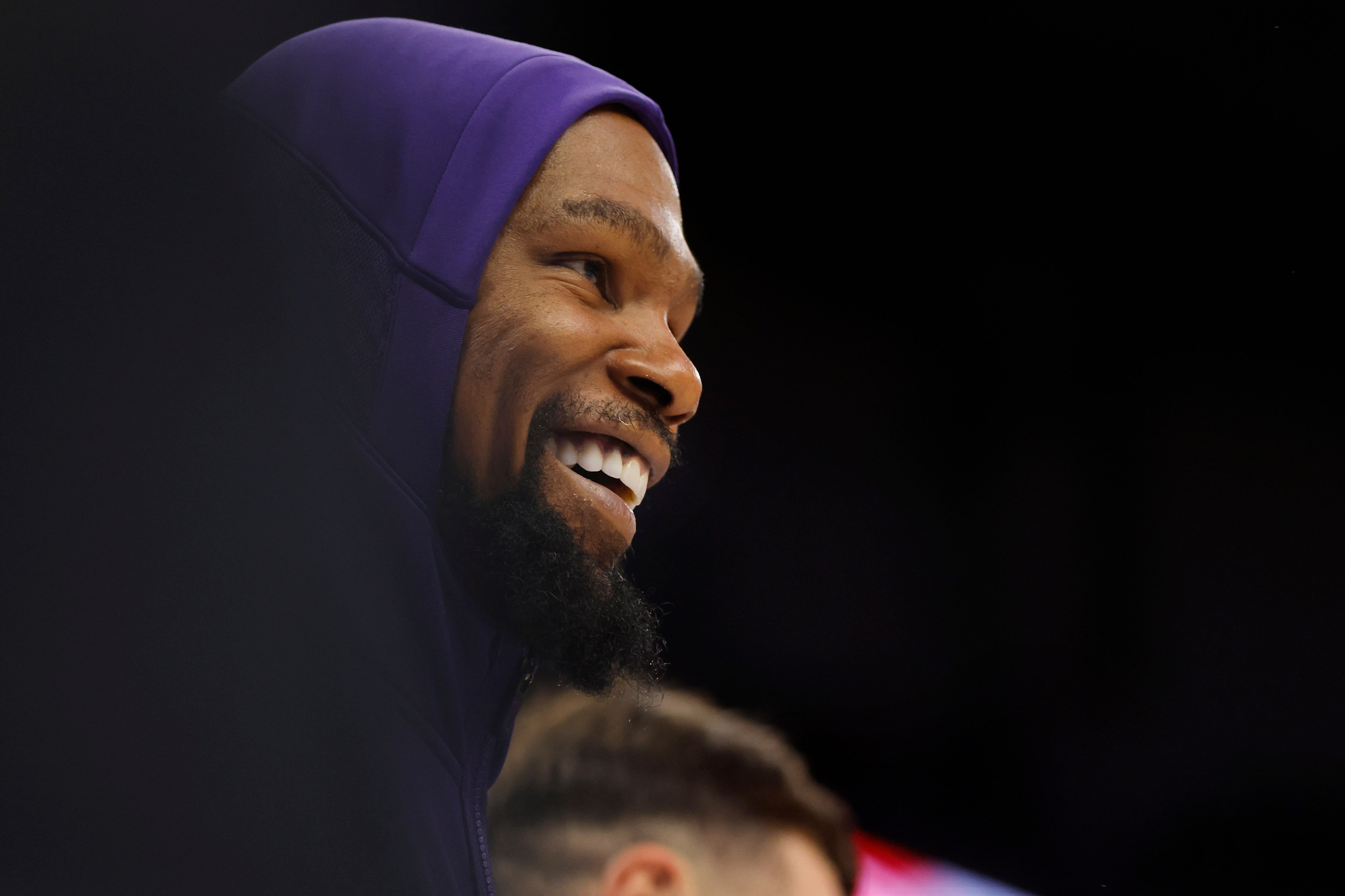 Phoenix Suns forward Kevin Durant smiles from the bench as his teammates defeat the Minnesota Timberwolves. Photo Credit: Imagn