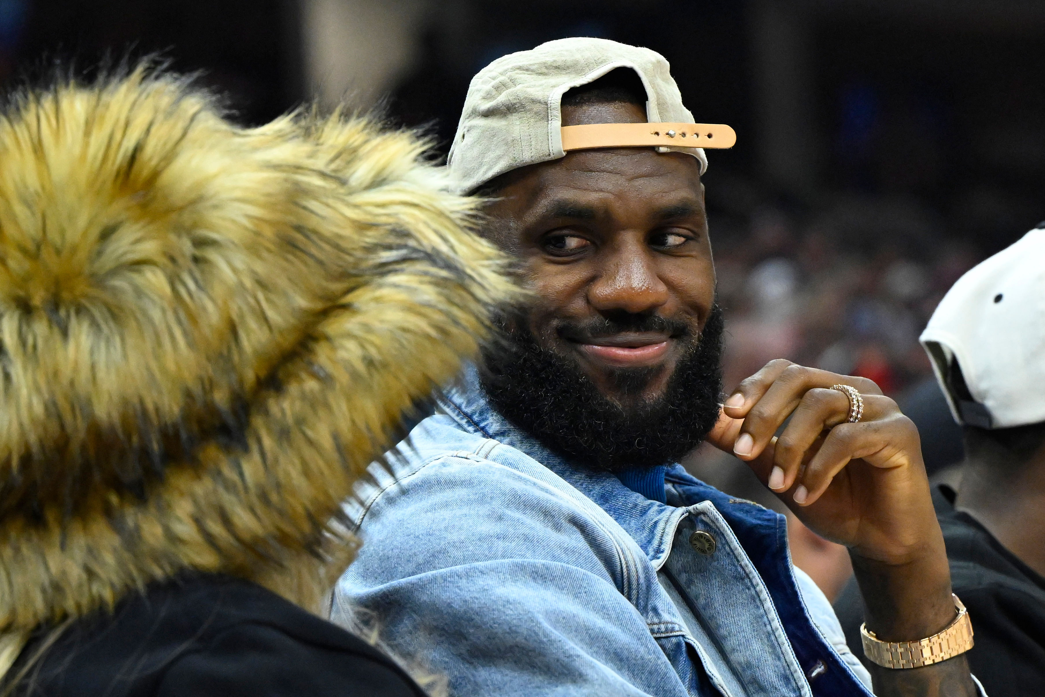 James looks at his wife Savannah James during a game. (Photo Credit: Imagn)