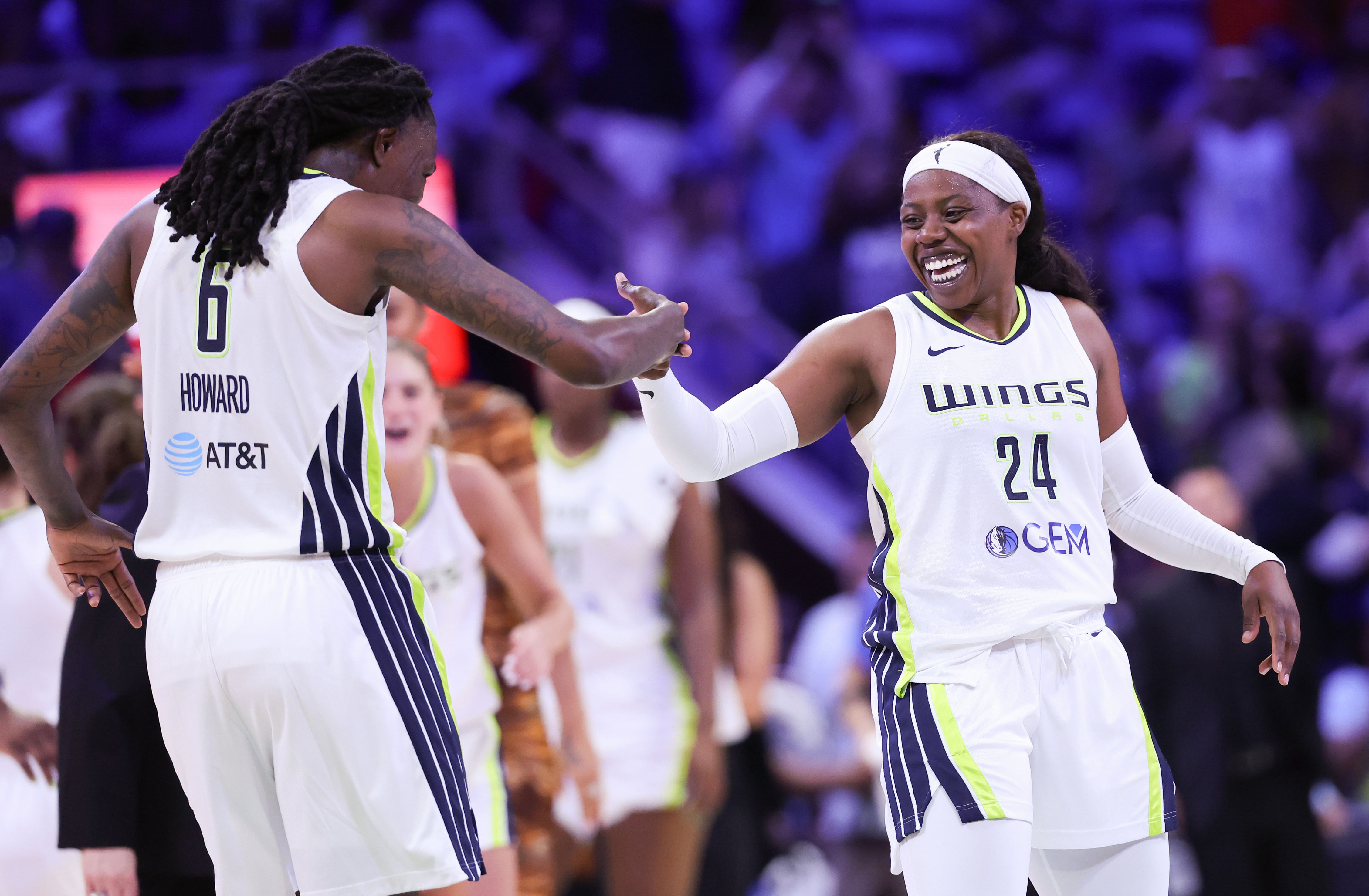 Dallas Wings guard Arike Ogunbowale celebrates with Natasha Howard at College Park Center. Photo Credit: Imagn