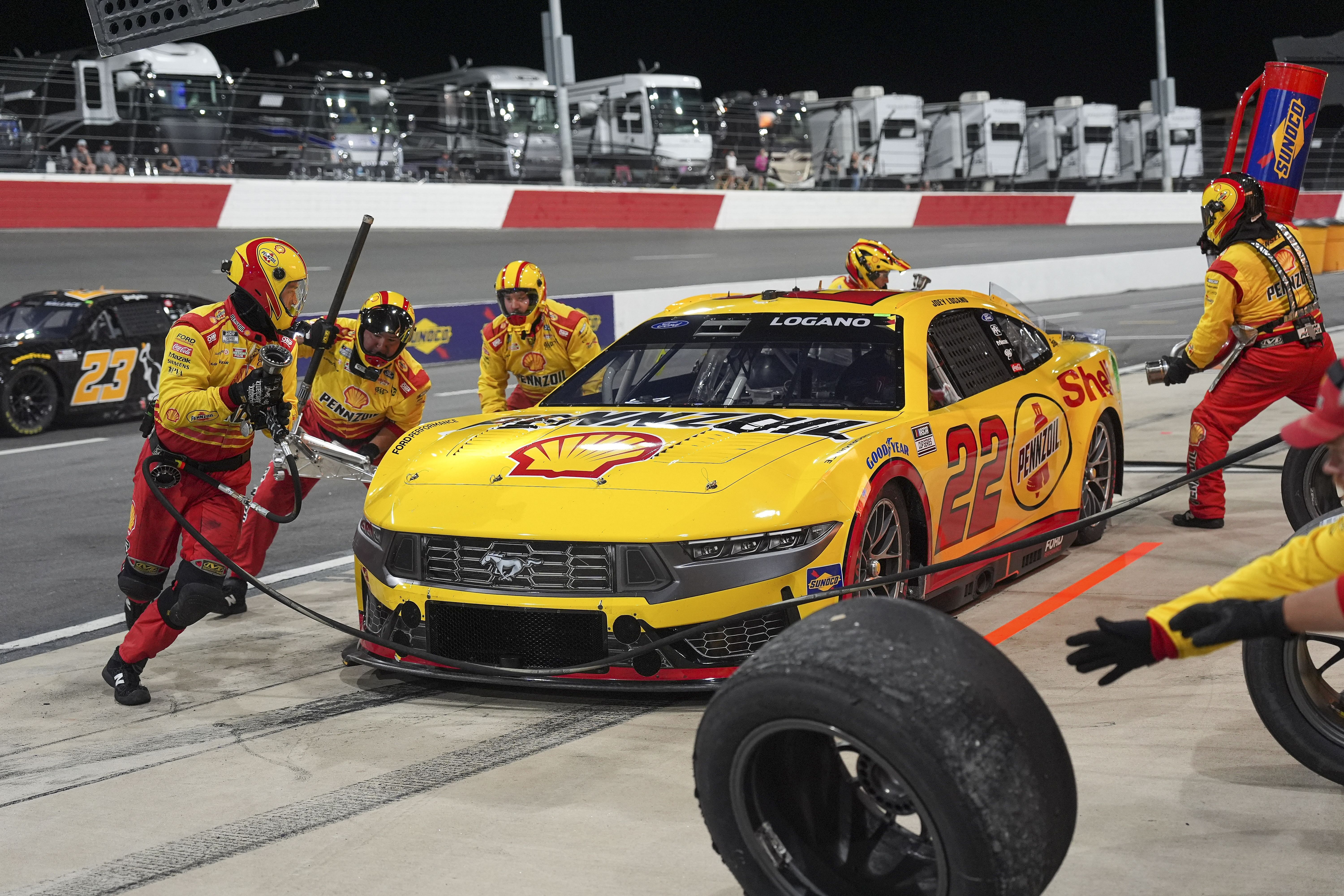 NASCAR Cup Series driver Joey Logano (22) pit crew goes to work during the All Star race at North Wilkesboro Speedway. Mandatory Credit: Jim Dedmon-USA TODAY Sports