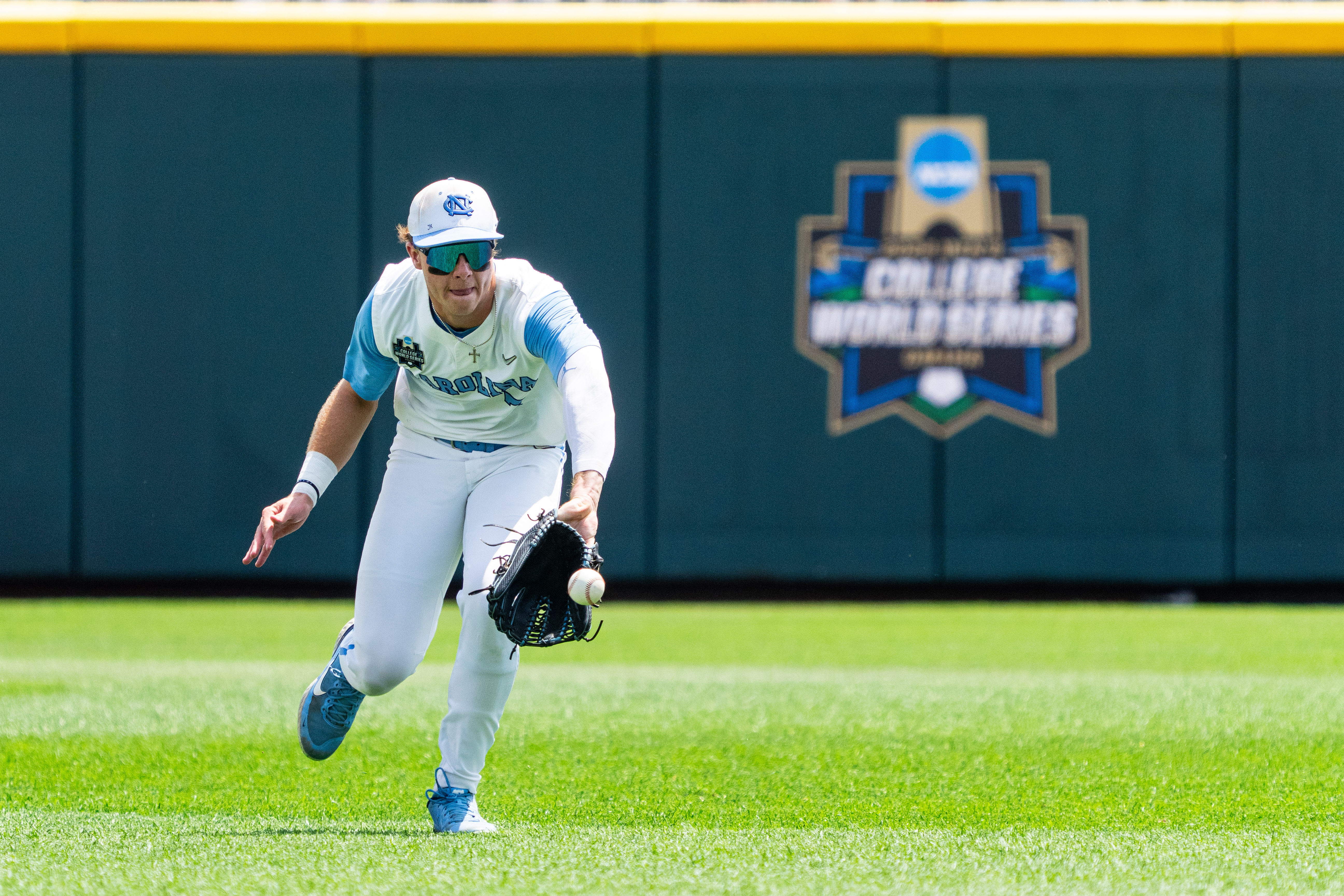 Vance Honeycutt backhands a ball in one of the College World Series games for North Carolina (Image Source: IMAGN).