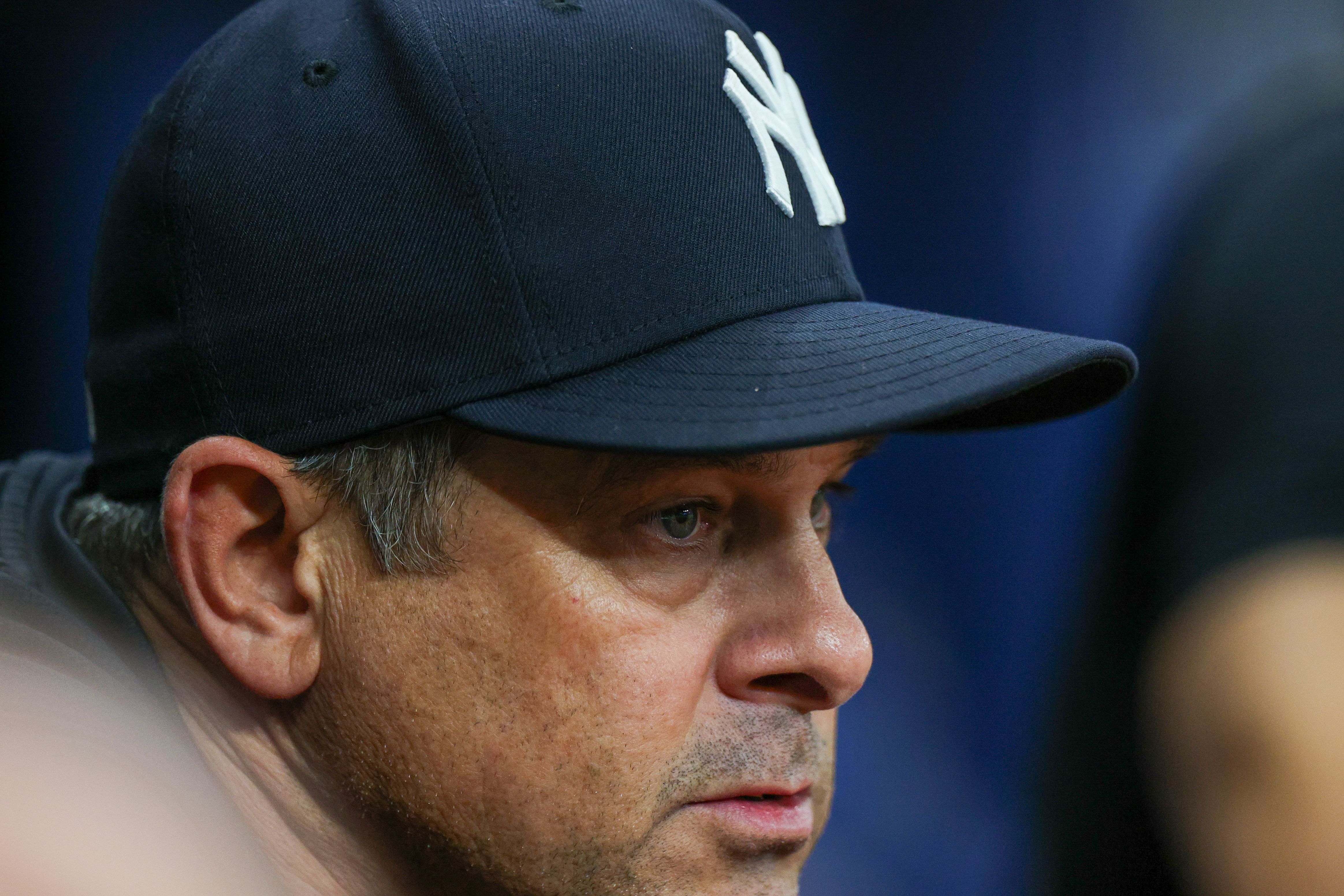 Aaron Boone looks on from the dugout against the Tampa Bay Rays. Credits: IMAGN