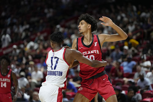 Atlanta Hawks forward Zaccharie Risacher competes against Washington Wizards guard Bub Carrington at Thomas & Mack Center (Photo Credit: Imagn)