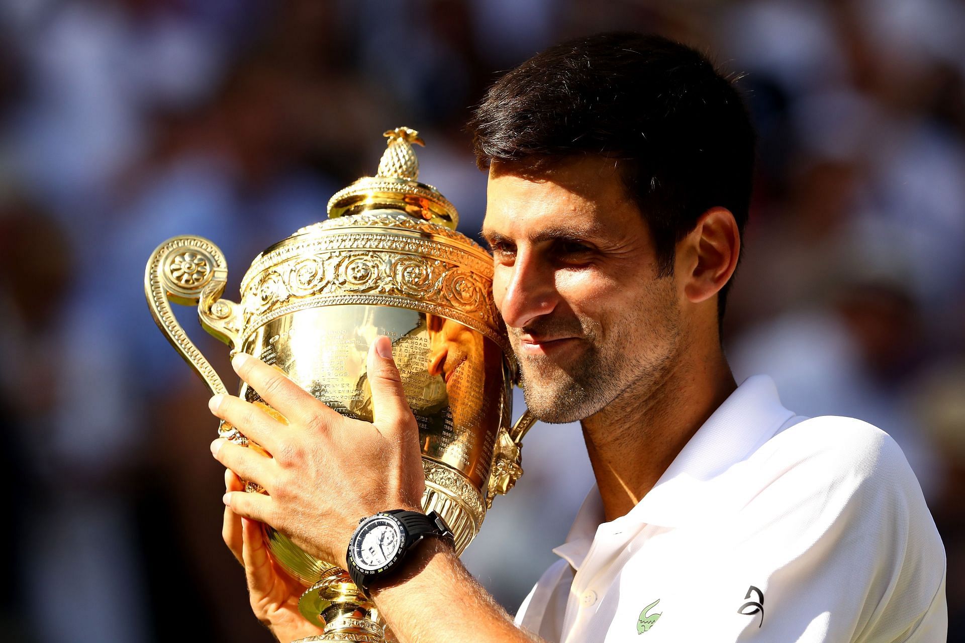 Novak Djokovic pictured with Wimbledon 2018 trophy