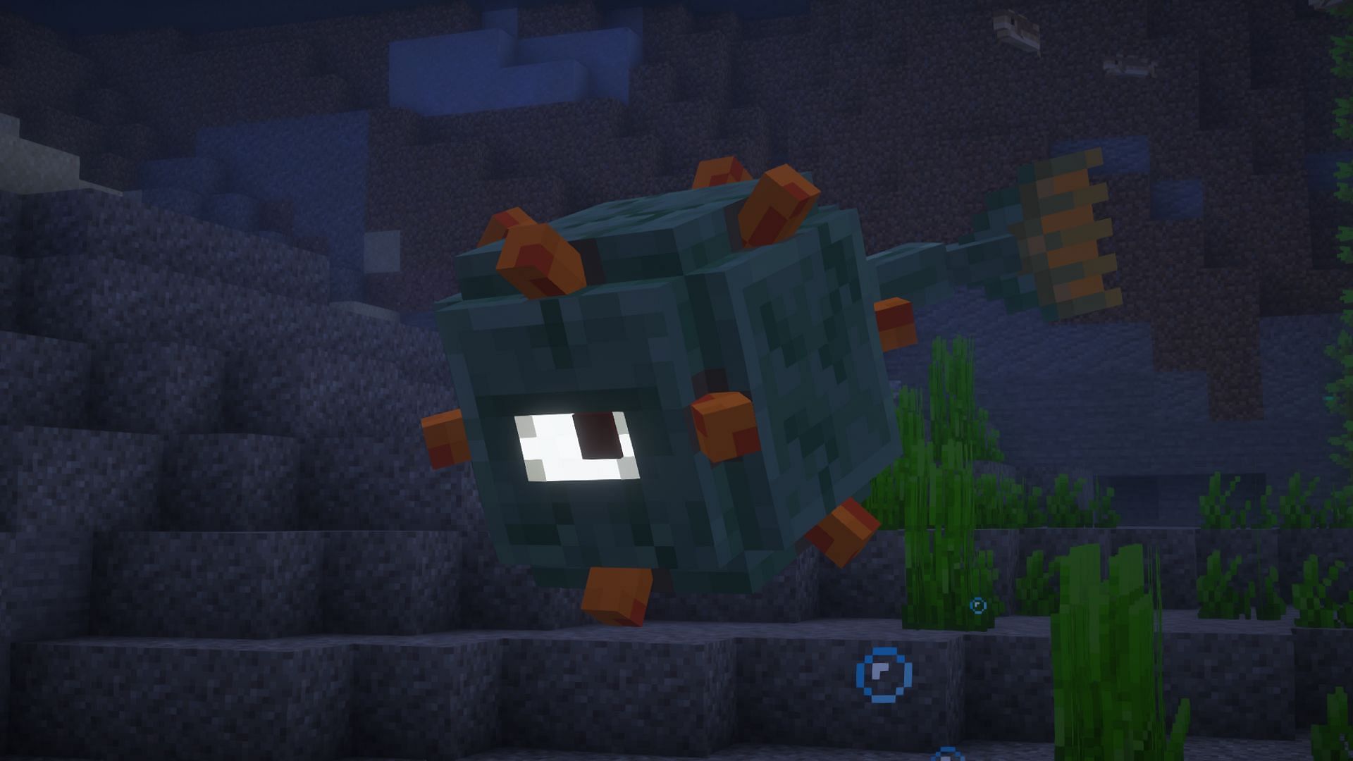 A guardian swimming in water (Image via Mojang)