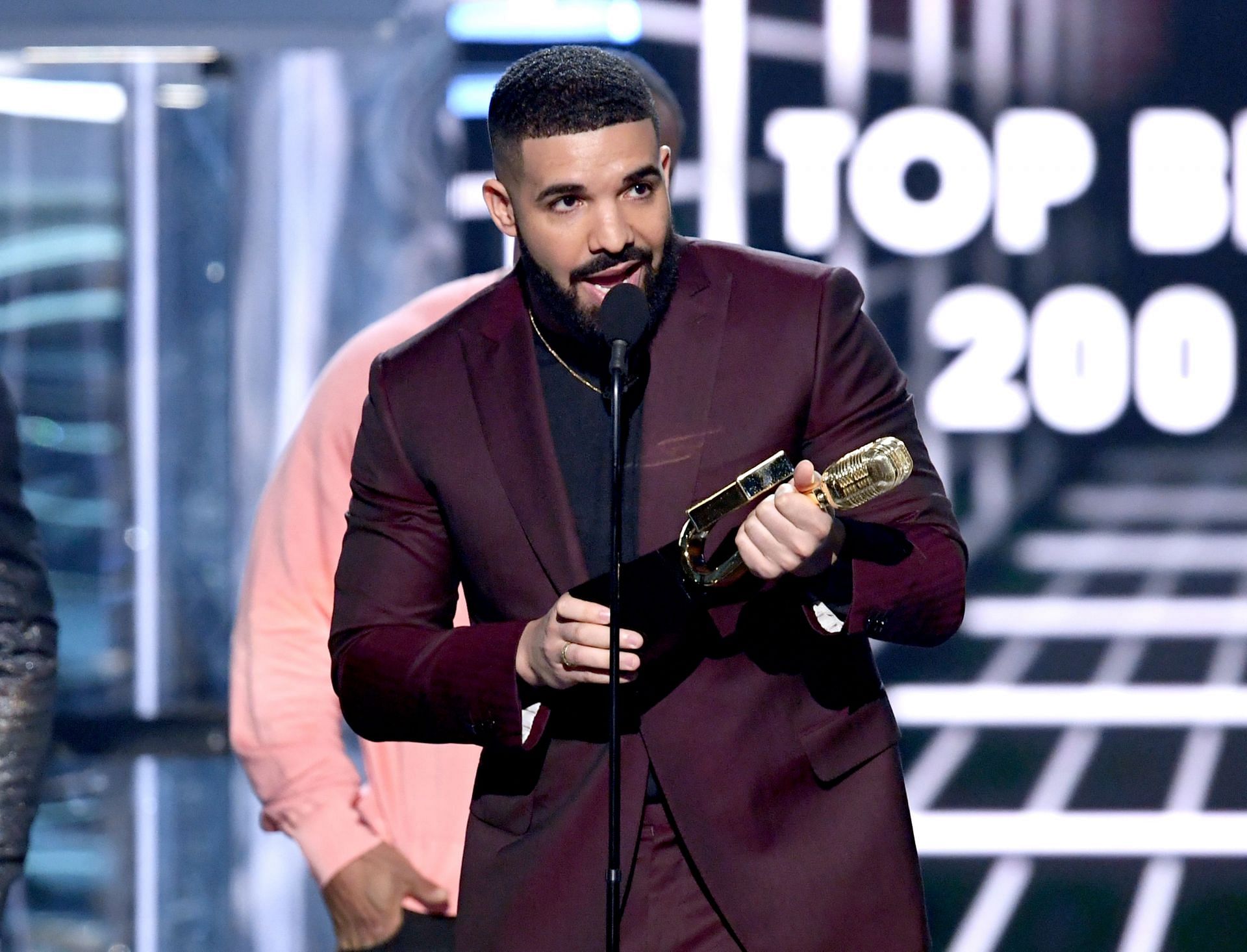 Drake has secured the second spot as the most famous artist this year (Image via Kevin Winter/Getty Images)