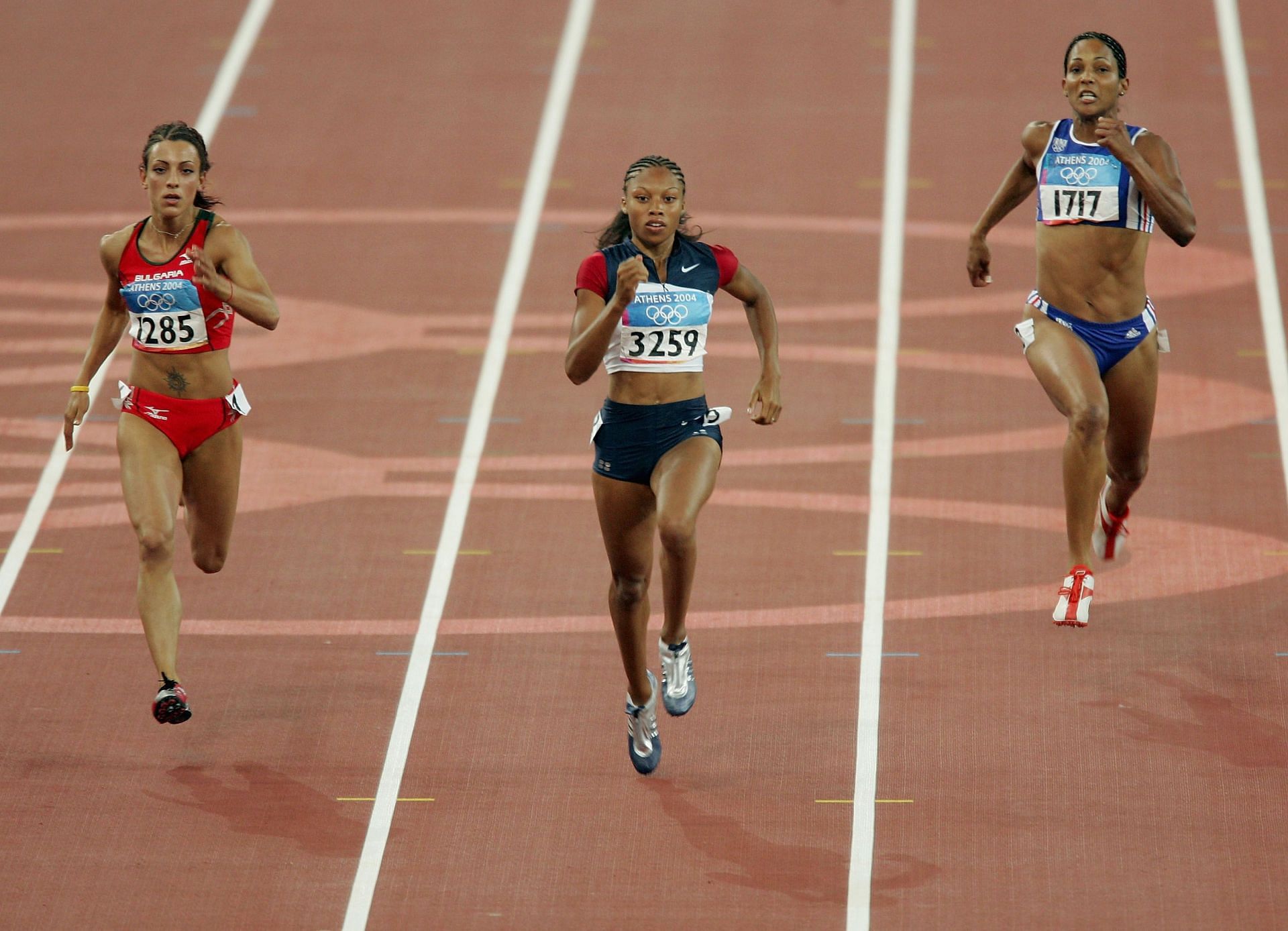 Christine Arron of France [R] competing at Athens Olympics 2004 [Image Source: Getty]