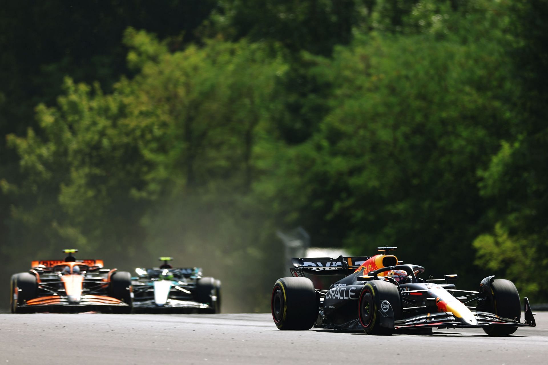 Max Verstappen of the Netherlands driving the (1) Oracle Red Bull Racing RB20 leads Lando Norris of Great Britain driving the (4) McLaren MCL38 Mercedes during the F1 Grand Prix of Hungary at Hungaroring on July 21, 2024 in Budapest, Hungary. (Photo by Dean Mouhtaropoulos/Getty Images)