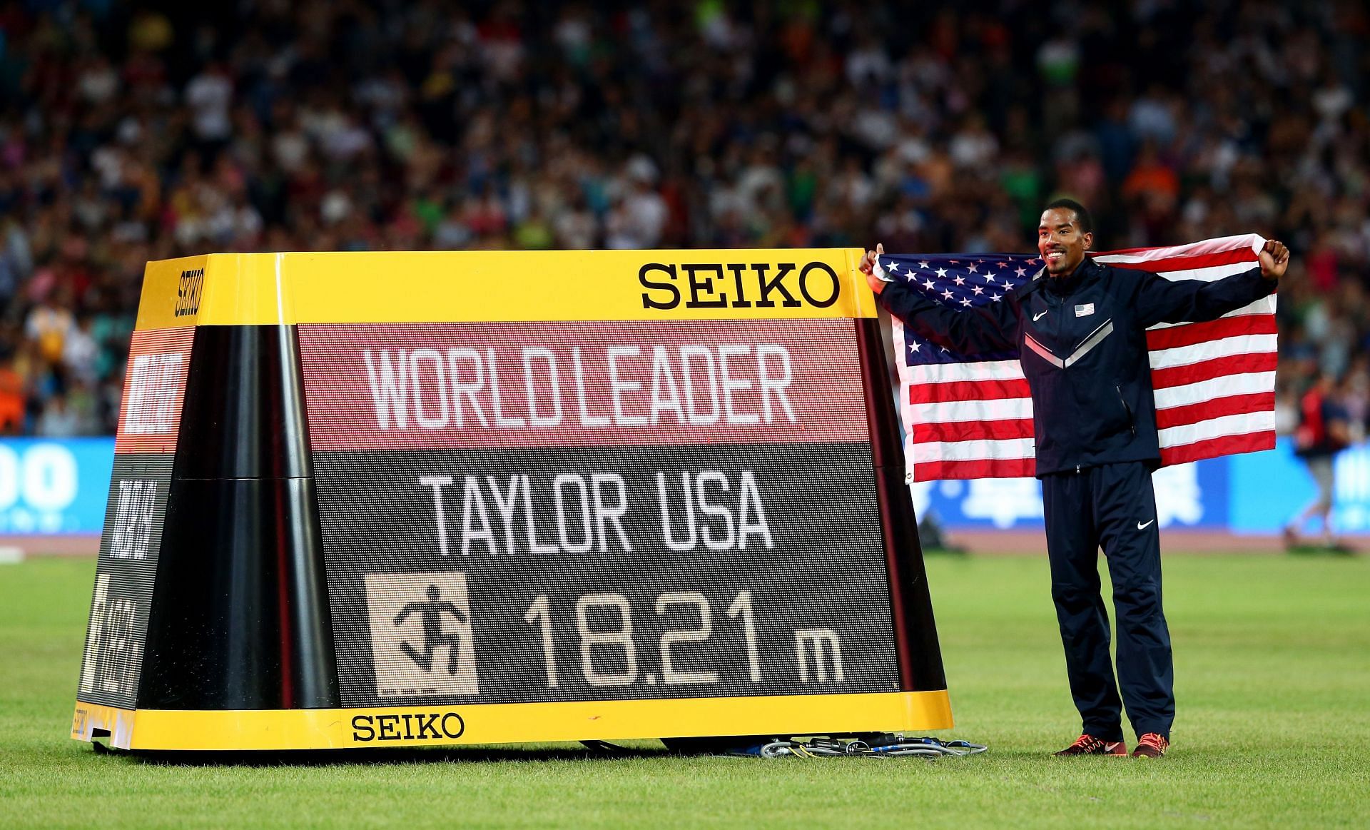 Christian Taylor after winning the gold medal at the Beijing World Championships [Image Source: Getty]