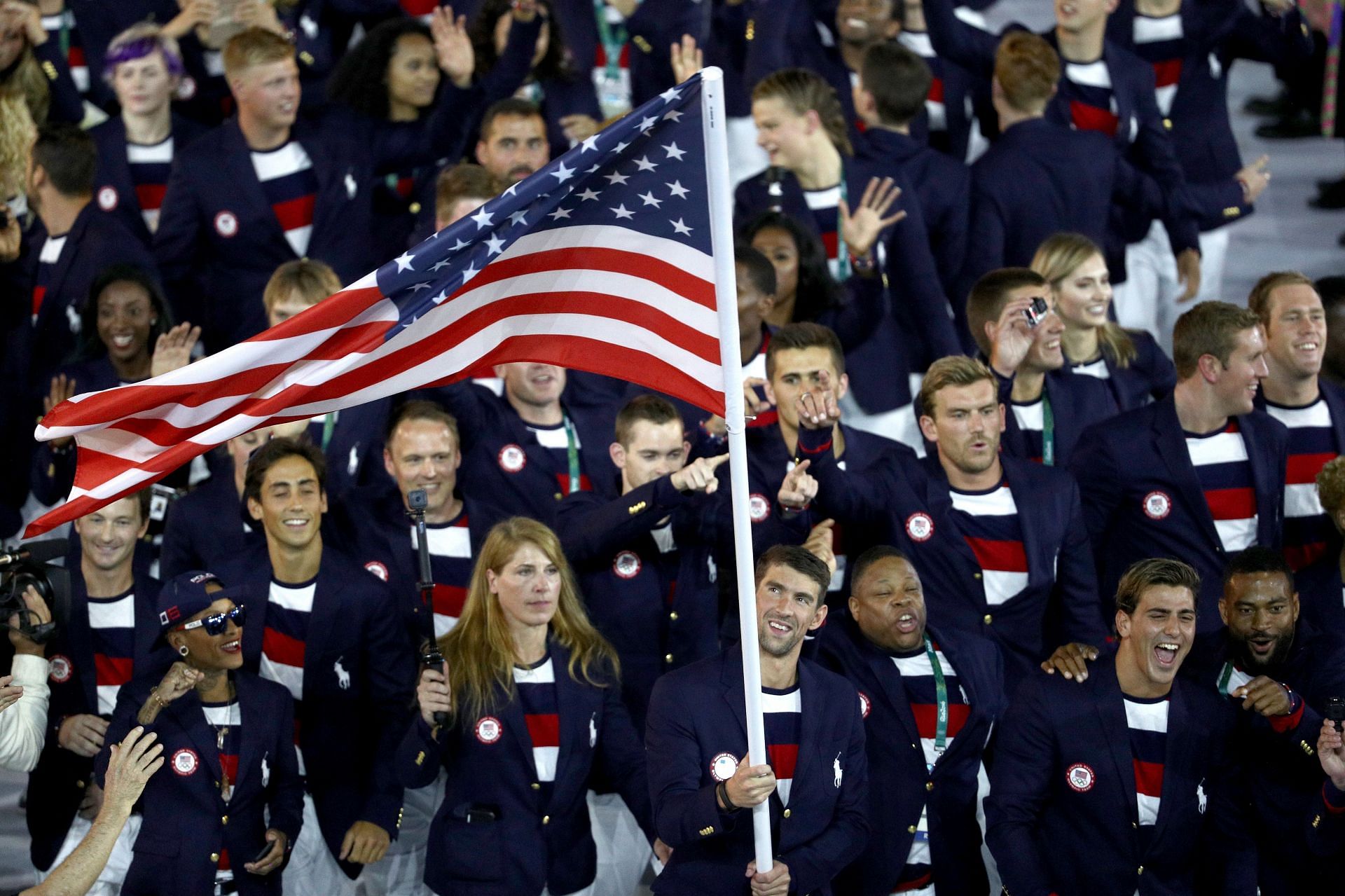 Flag bearer Michael Phelps of the United States leads the U.S. Olympic Team during the Opening Ceremony of the Rio 2016 Olympic Games at Maracana Stadium on August 5, 2016 in Rio de Janeiro, Brazil. (Photo by Paul Gilham/Getty Images)