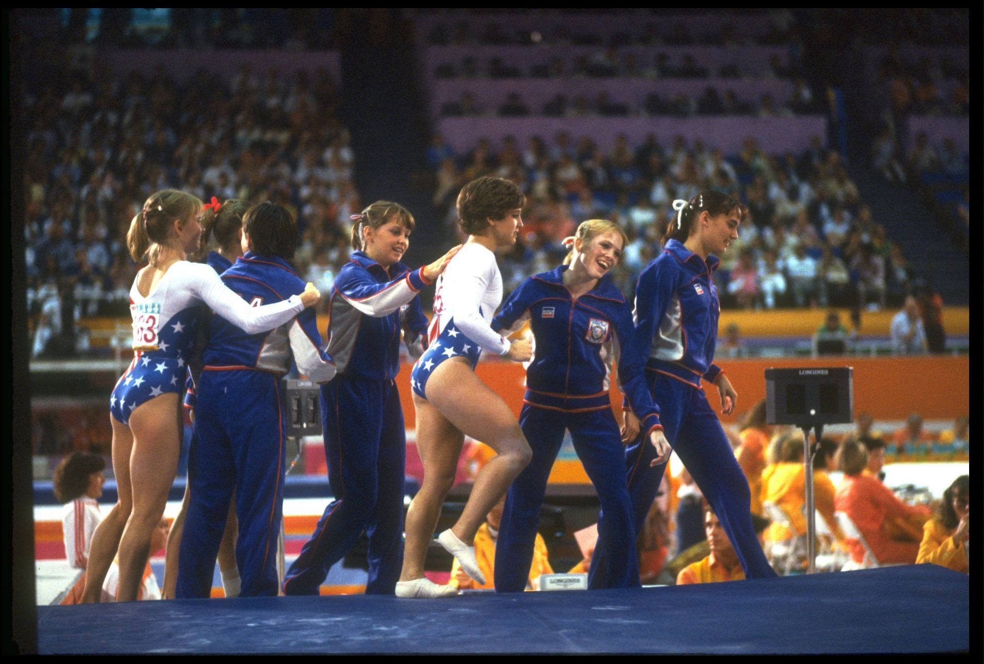 Mary Lou Retton congratulated by teammates at Los Angeles Olympics 1984 [Image Source: Getty]