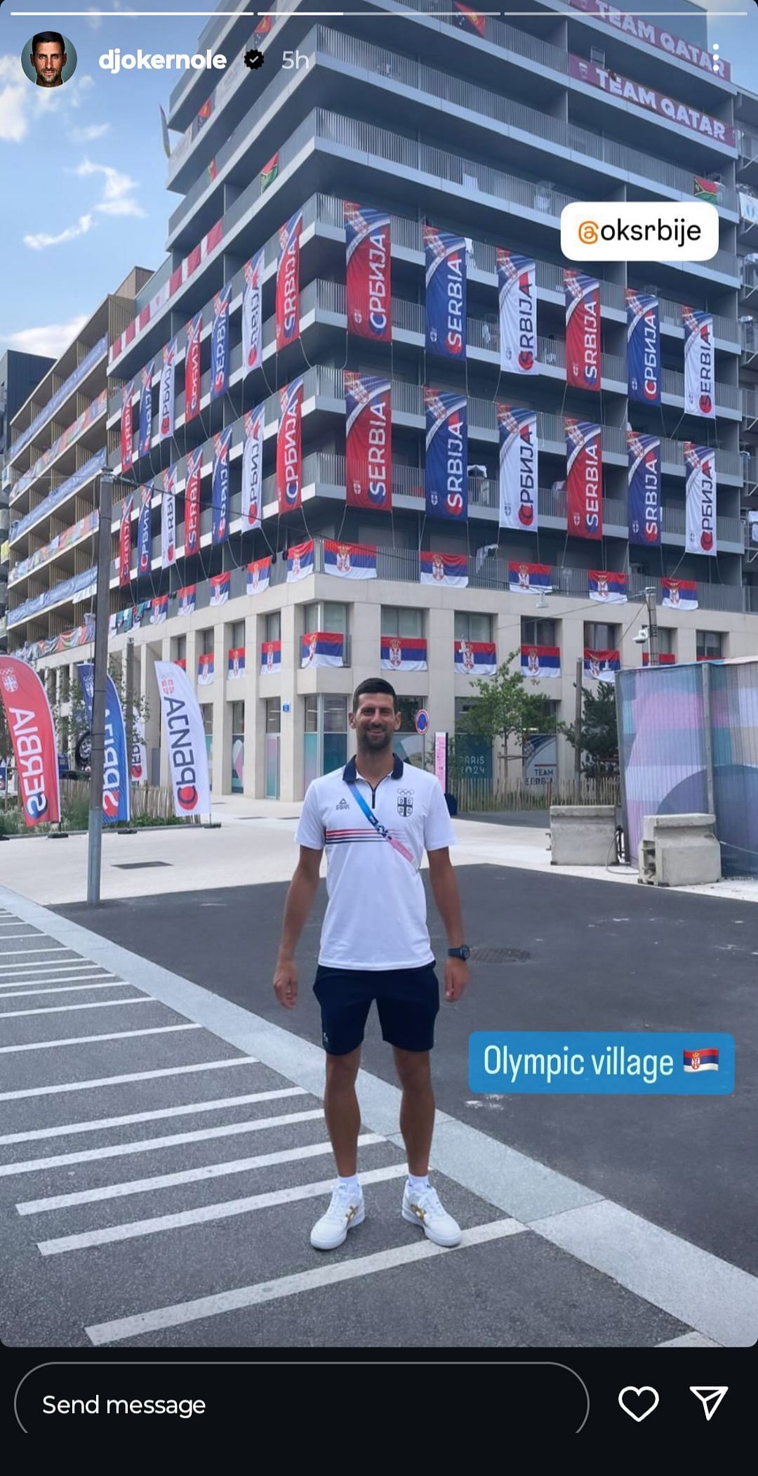 Novak Djokovic posing in front of the Serbian section of the Olympic Village (Source: Instagram/Novak Djokovic)