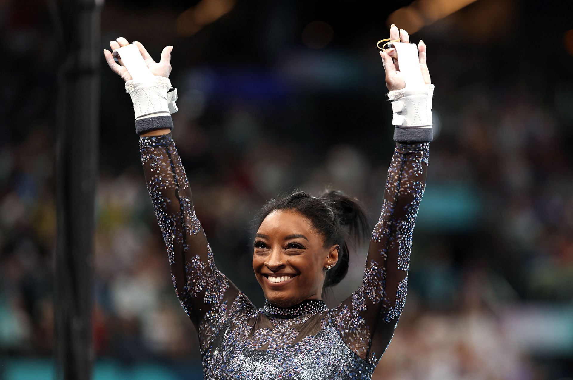 Simone Biles reacts after finishing her routine on the uneven bars during the Artistic Gymnastics Women&#039;s Qualification at the Olympic Games 2024 in Paris, France. (Photo by Ezra Getty Images)