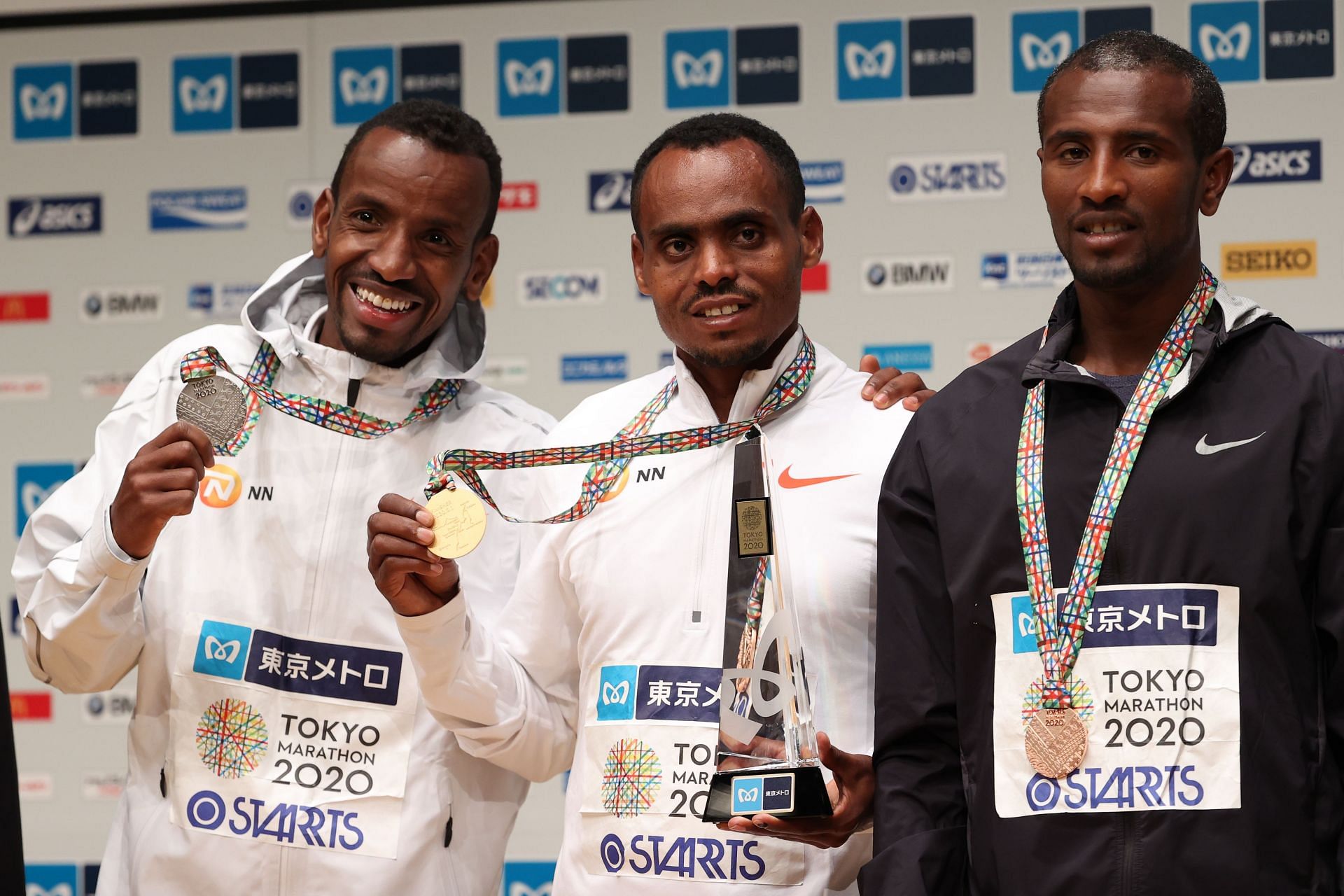 Birhanu Legese [C] with other medalists at Tokyo Marathon [Image Source: Getty]