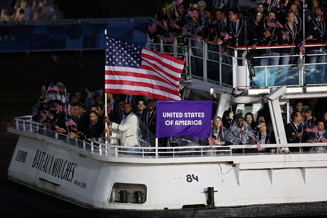 PARIS, FRANCE - JULY 26: Lebron James, Flagbearer of Team United States, is seen waving their flag on a boat with team mates along the River Seine during the opening ceremony of the Olympic Games Paris 2024 on July 26, 2024 in Paris, France. (Photo by Alex Broadway/Getty Images) - Source: Getty