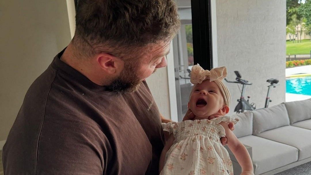 Chris Bumstead with his daughter via @cbum on Instagram