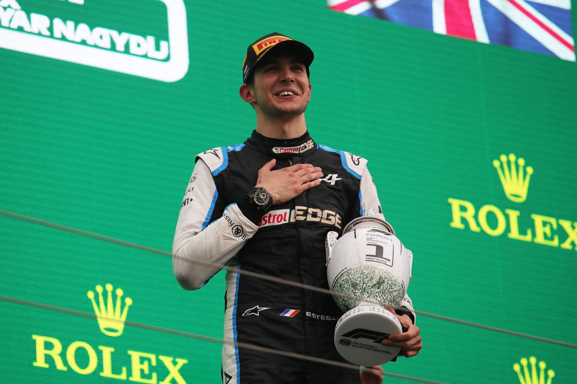 Esteban Ocon of France and Alpine F1 Team celebrates on the podium during the F1 Grand Prix of Hungary - Getty Images