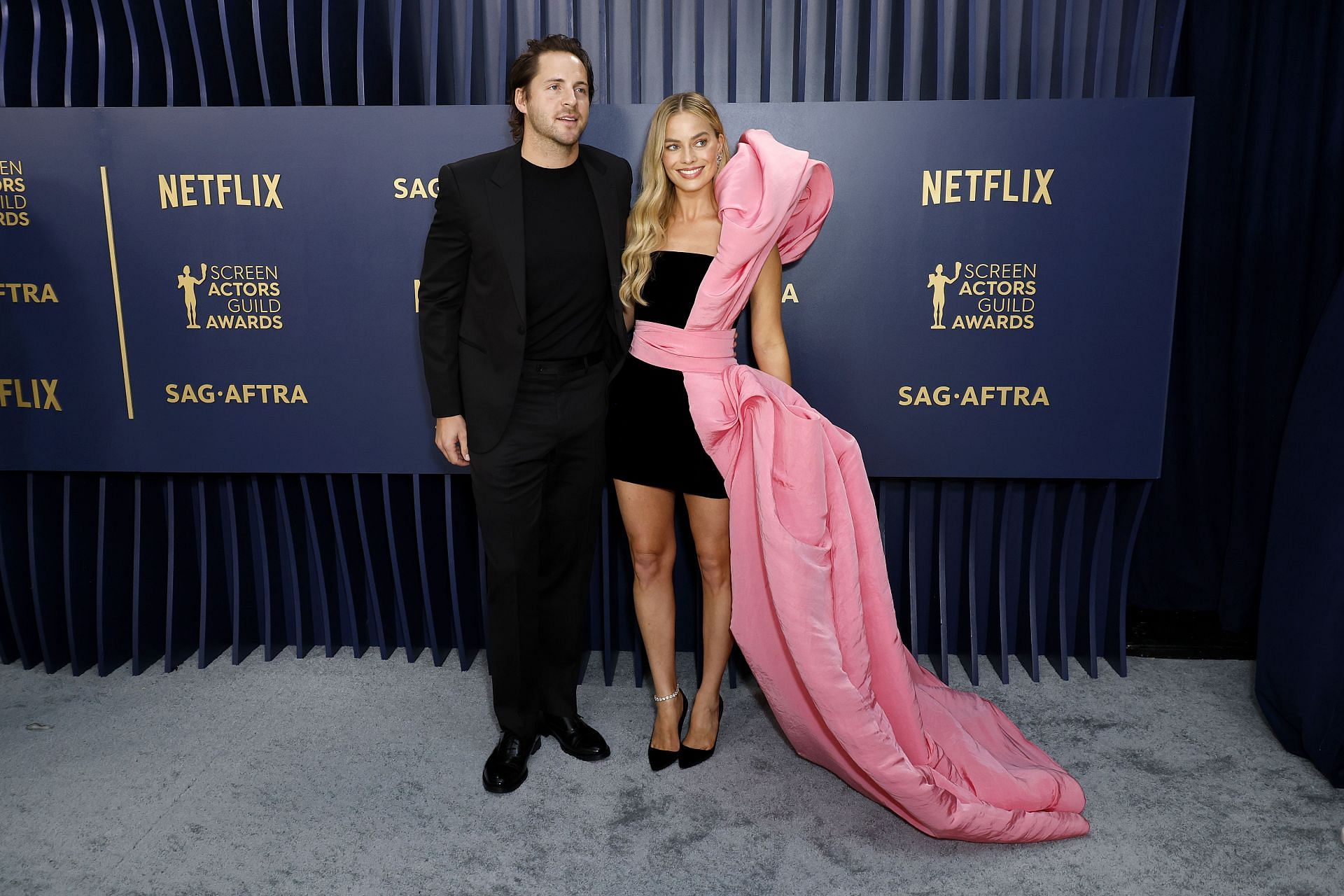 Margot Robbie and Tom Ackerley (Image via Frazer Harrison/Getty Images)