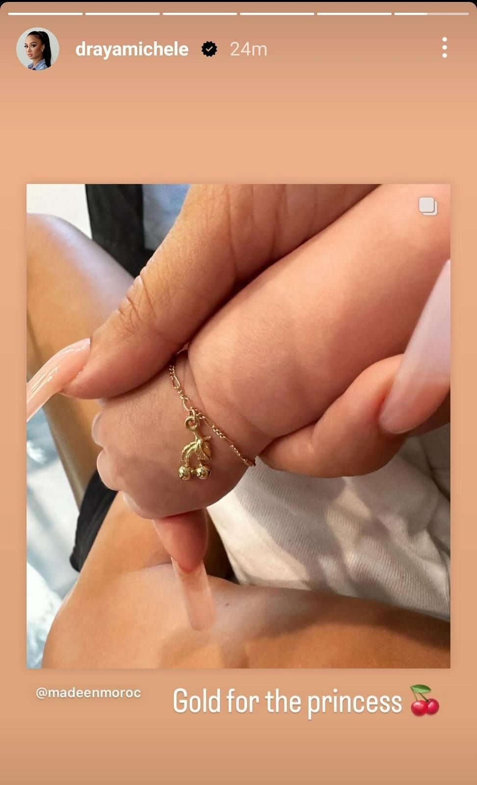 Draya Michele shows daughter&#039;s gold bracelet (via @drayamichele on Instagram) 