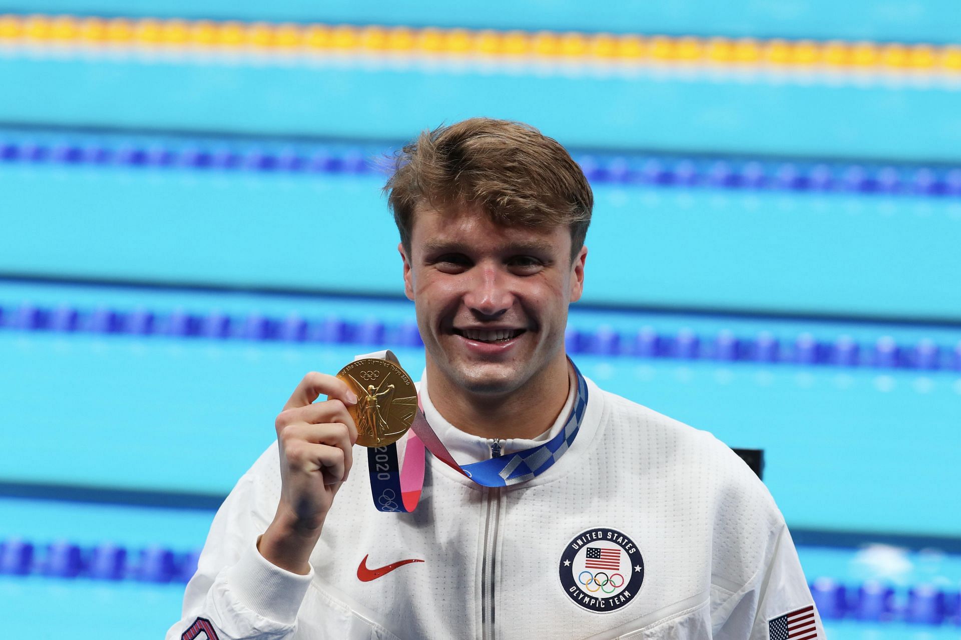 Robert Finke poses with his gold medal at the 2020 Tokyo Olympics. (Photo by Xavier Laine/Getty Images)