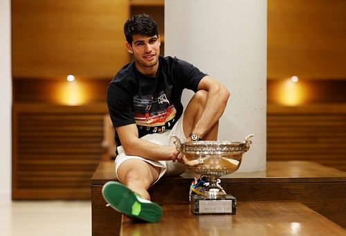 Carlos Alcaraz with the 2024 French Open trophy.