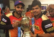 Karn Sharma with IPL 2016 Purple Cap winner Bhuvneshwar Kumar after winning the IPL 2016 trophy (Image Credits: Karn Sharma's Instagram)