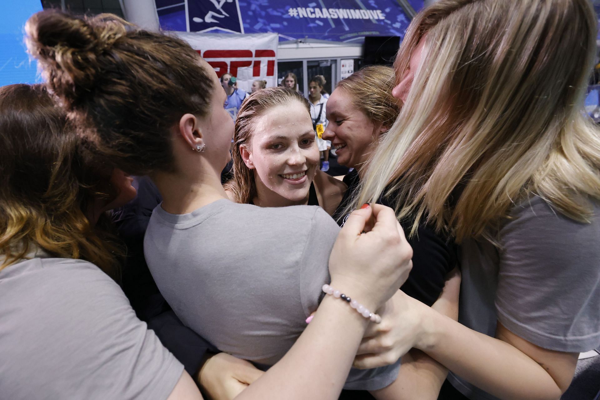 Katharine Berkoff [C] after winning the 100 yard backstroke finals at the NCAA Division I Swimming and Diving Championships 2024 | Getty