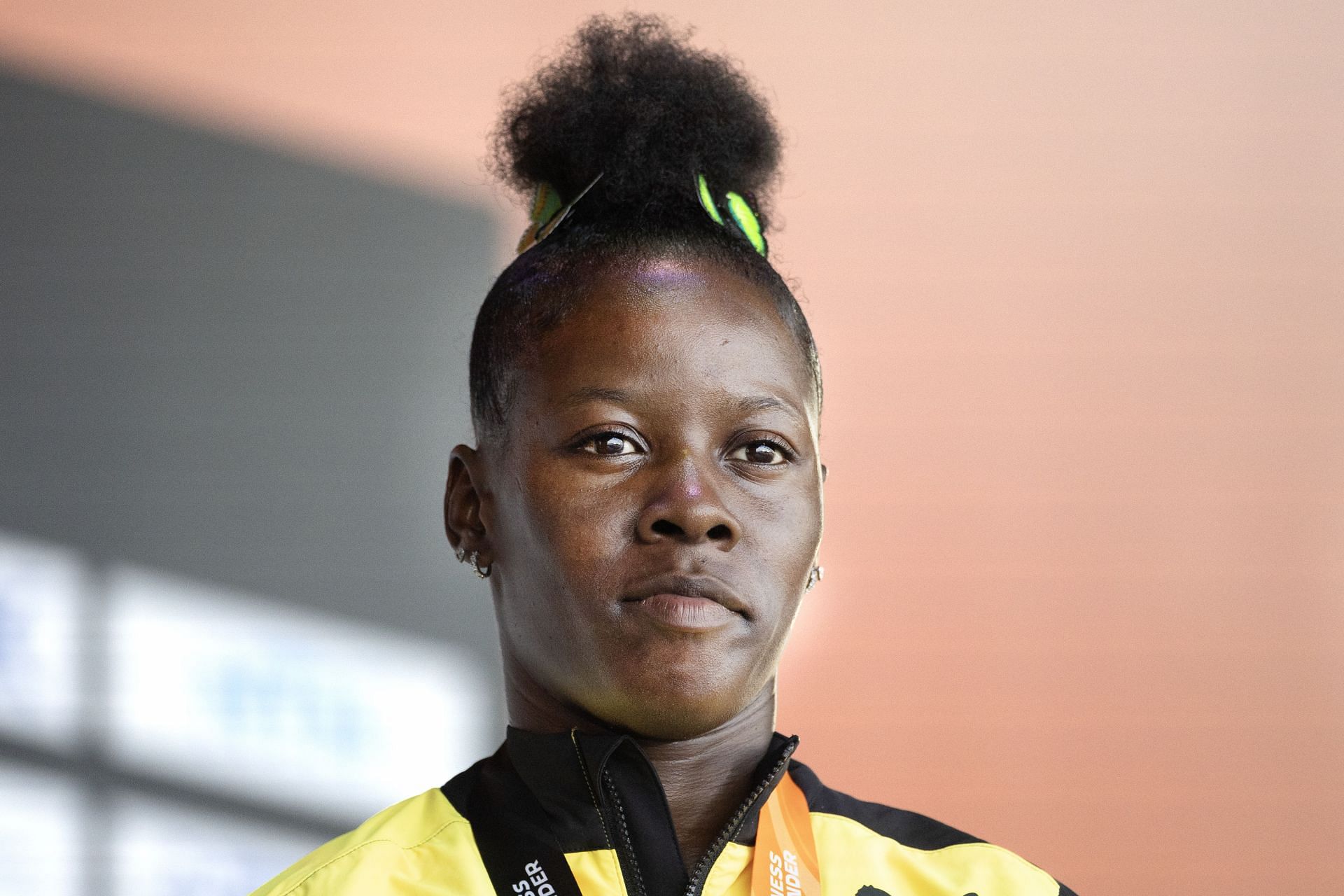 Why did Shericka Jackson withdraw from the 100m at Paris Olympics 2024