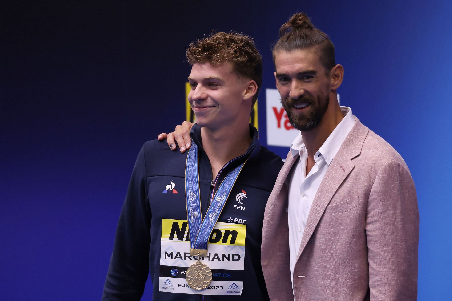 Leon Marchand and Michael Phelps at the World Swimming Championships (Image via Getty)