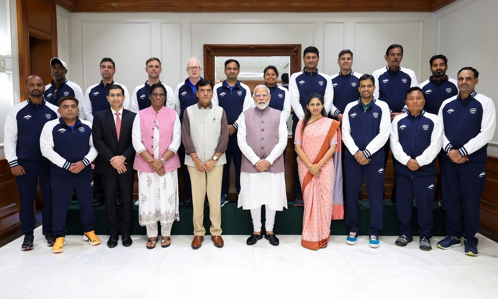 Narendra Modi with Paris-bound athletes. (Credit: X/Narendra Modi)