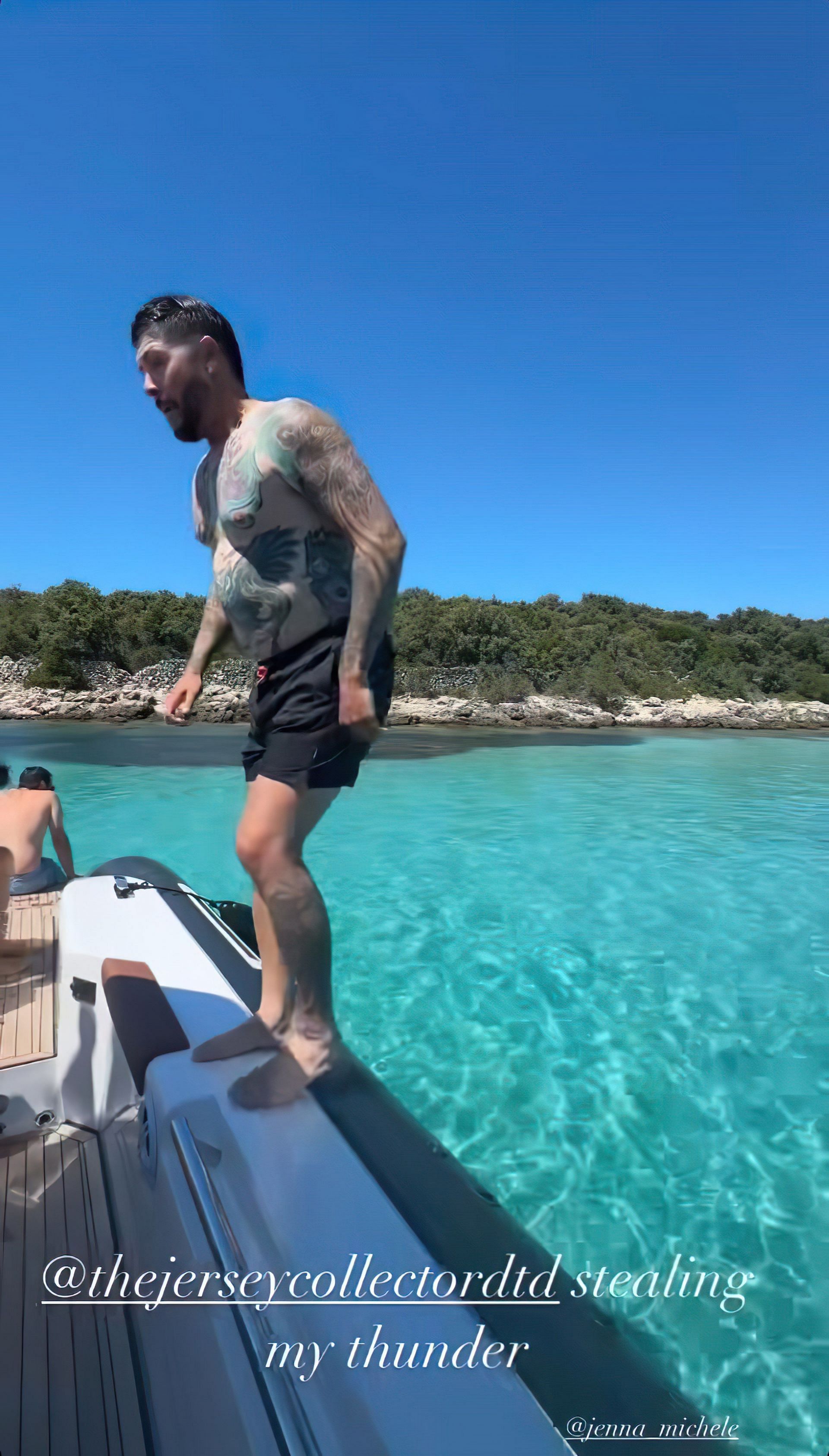 Travis Blackley does a backflip into the ocean from the yacht. Image via Instagram @jenasims