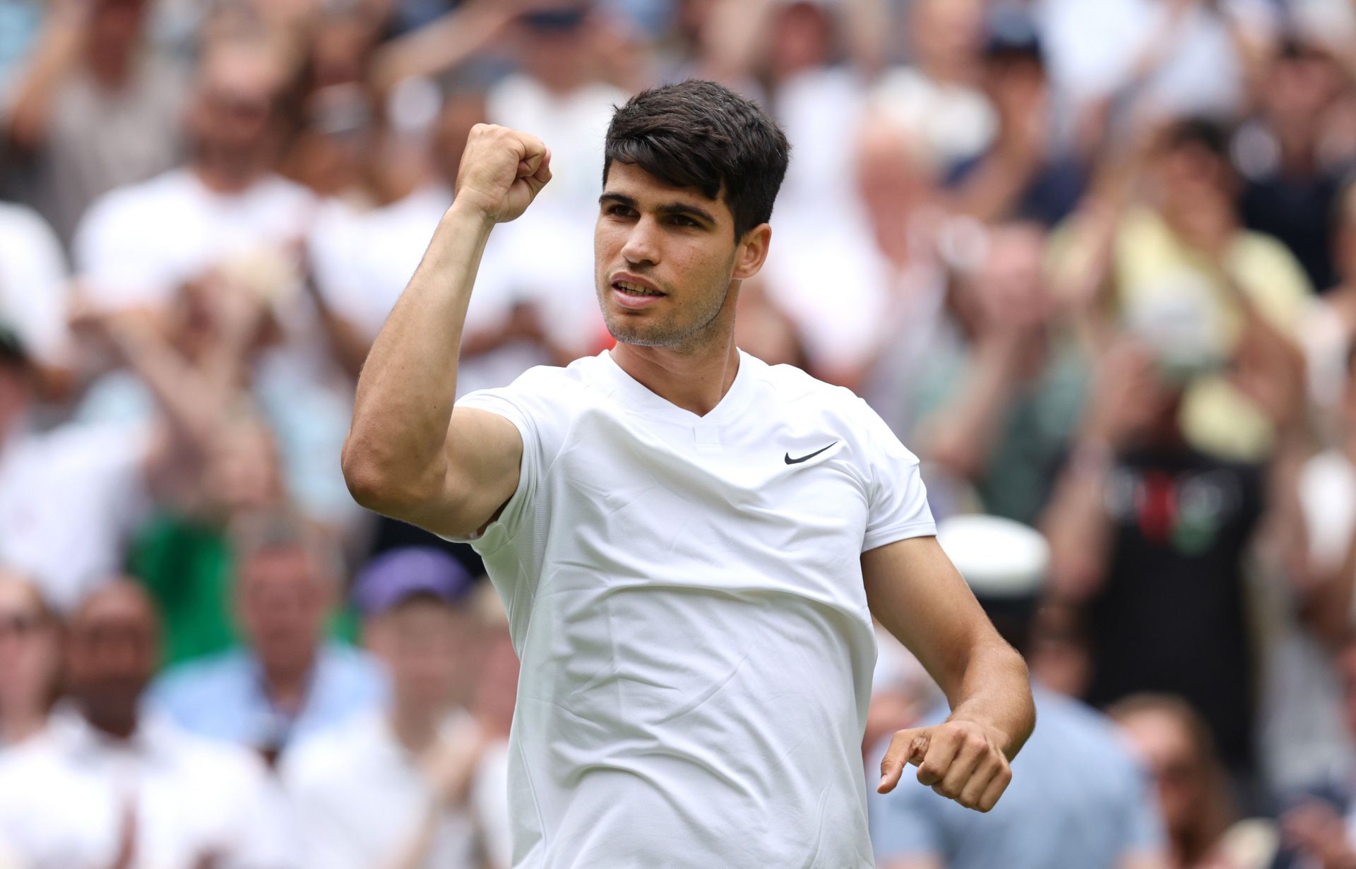 Carlos Alcaraz celebrates after reaching second round at Wimbledon 2024