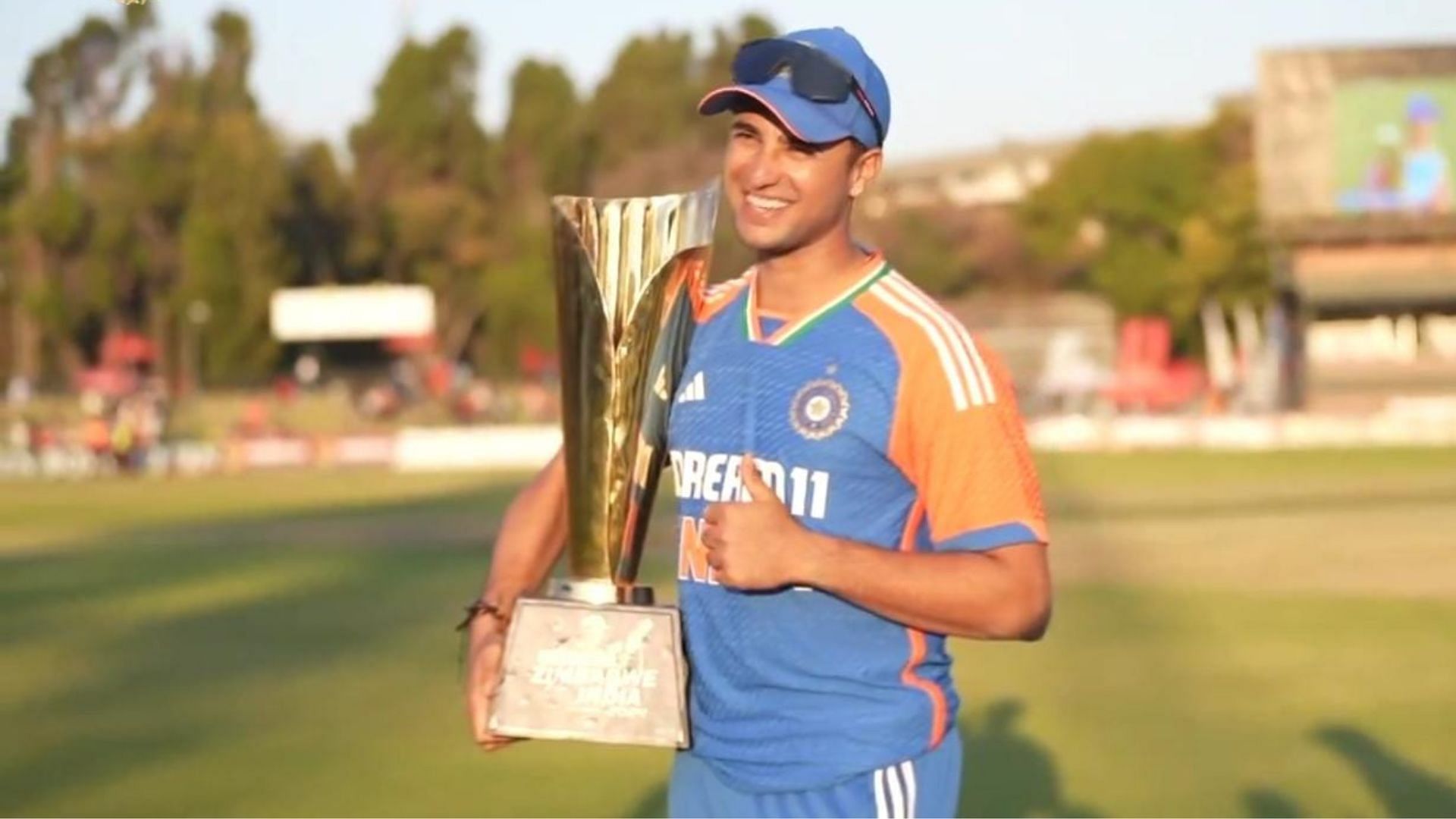 Abhishek Sharma posing with the trophy after the series win against Zimbabwe (P.C.:BCCI)