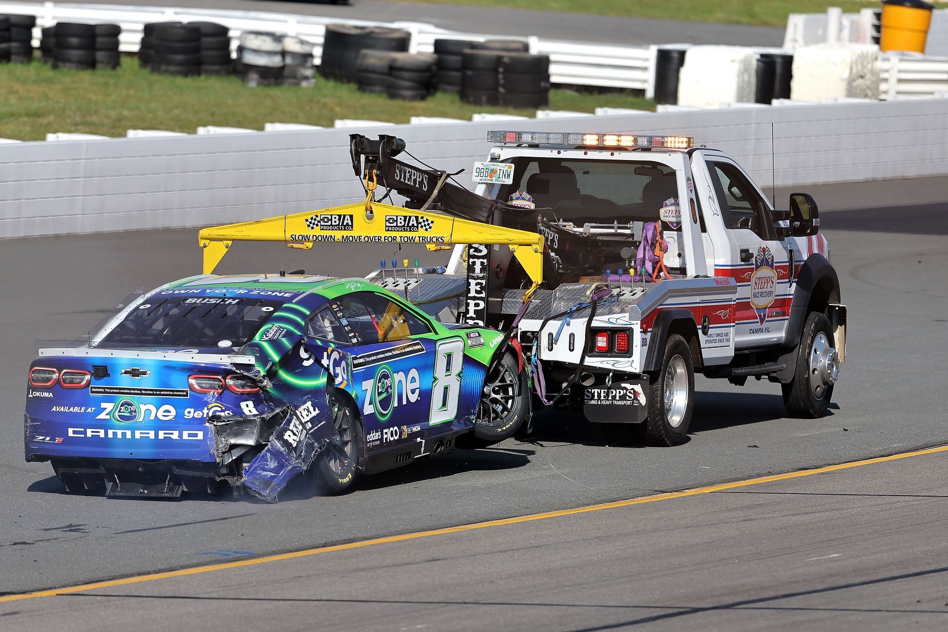 The #8 zone/GetGo Chevrolet, driven by Kyle Busch is towed after an on-track incident during the NASCAR Cup Series The Great American Getaway 400 Presented by VISITPA.com at Pocono Raceway on July 14, 2024 in Long Pond, Pennsylvania. (Photo by Jonathan Bachman/Getty Images)