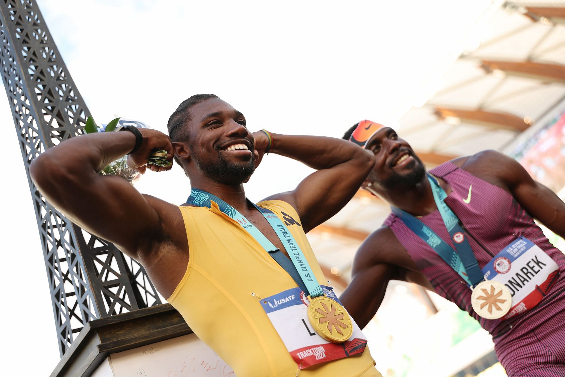 Noah Lyles posing with the gold medal and the miniature Eiffel Tower at the U.S. Olympic Team Trials 2024