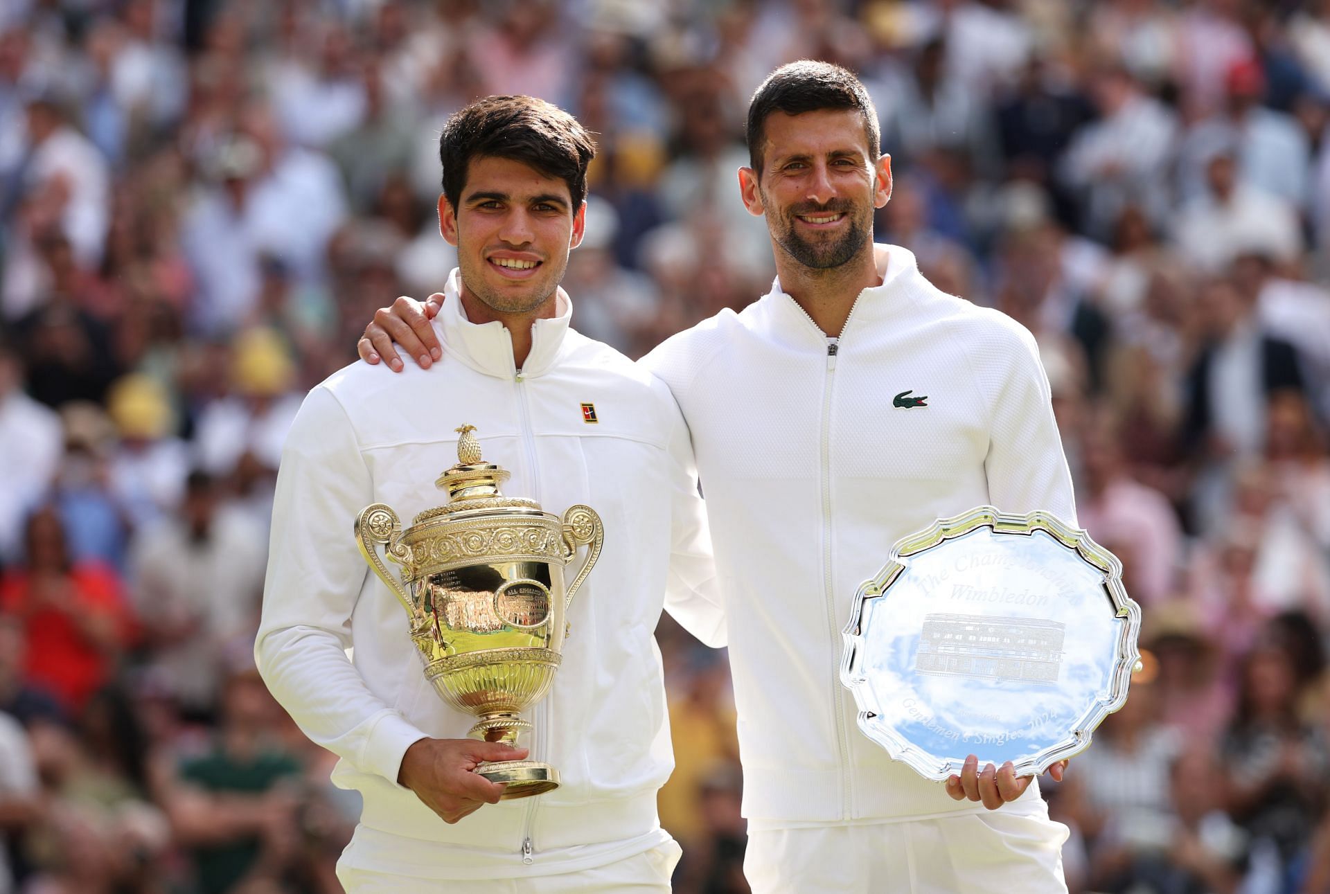 Carlos Alcaraz (L) and Novak Djokovic pictured at Wimbledon 2024