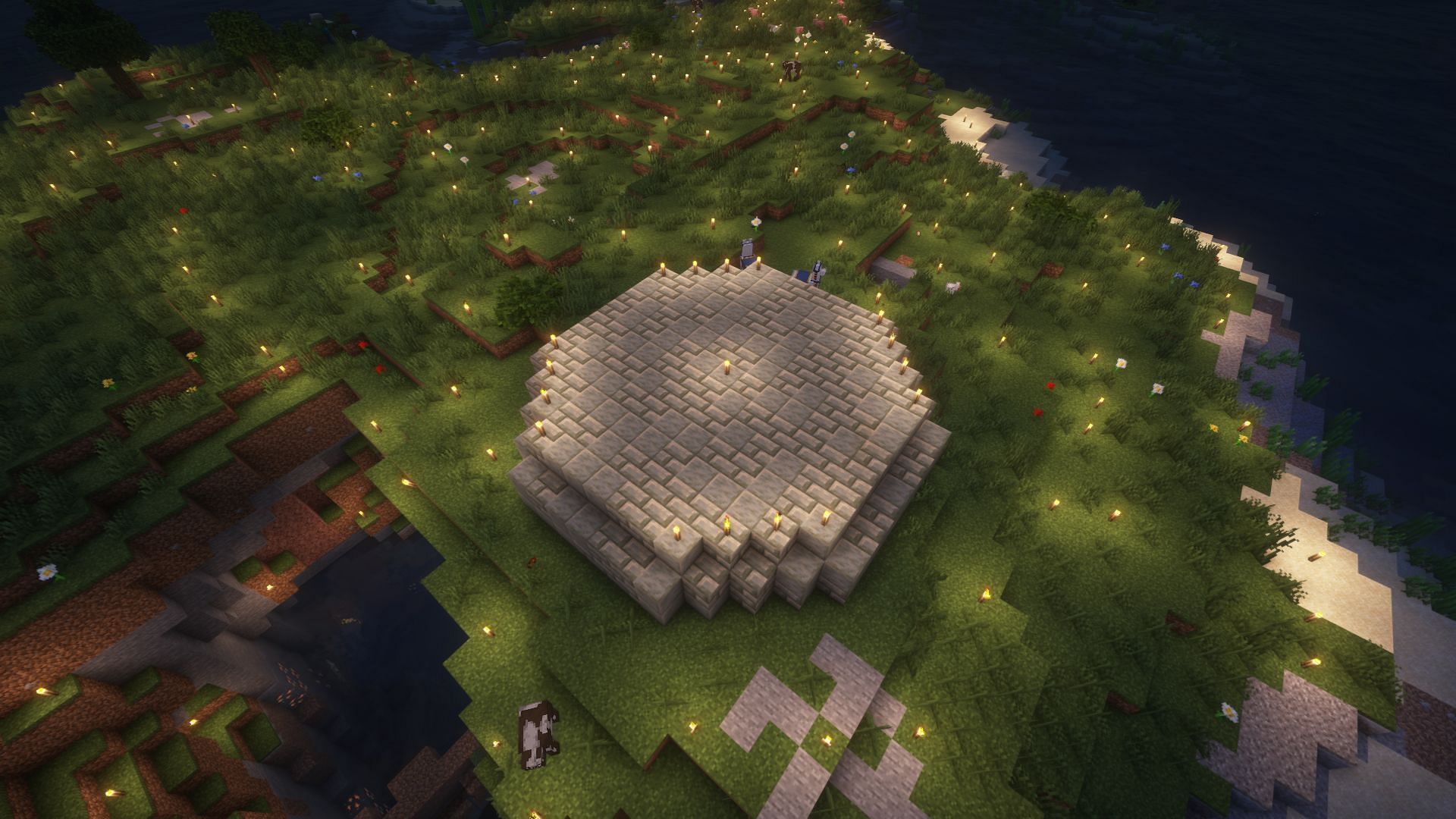 The area surrounding the farm lit up (Image via Mojang)