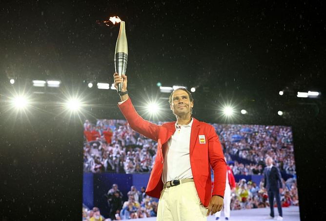 PICTURE: Rafael Nadal's stunning Paris Olympics update of him carrying the Olympic torch under a glittering Eiffel Tower goes viral