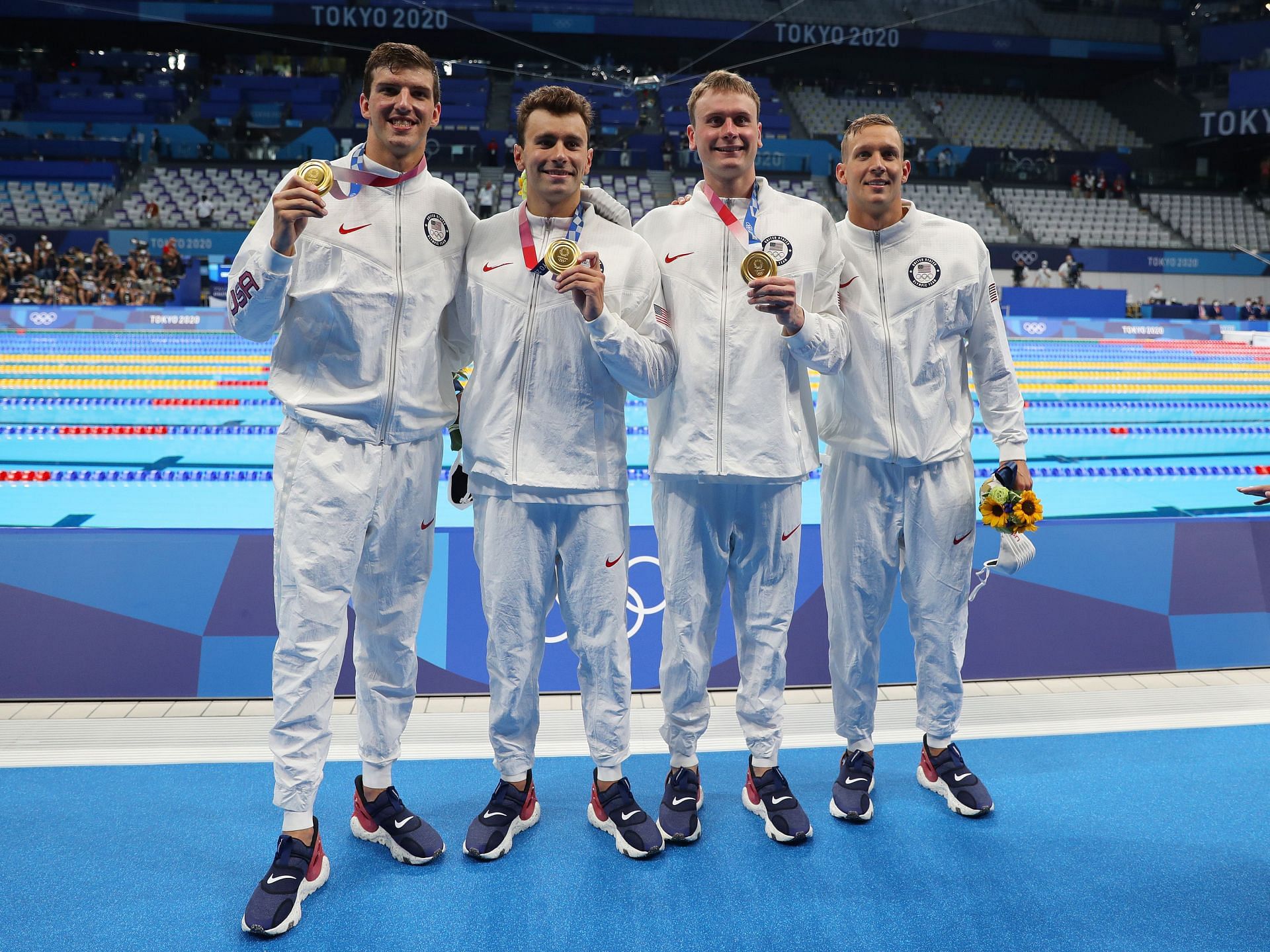 Team USA pose with their gold medals for the men&#039;s 4x100m freestyle relay at the 2020 Olympic Games in Tokyo, Japan - Getty Images