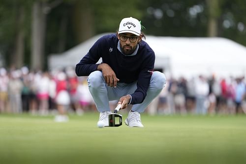 Akshay Bhatia lines up a putt during the final round of the Rocket Mortgage Classic