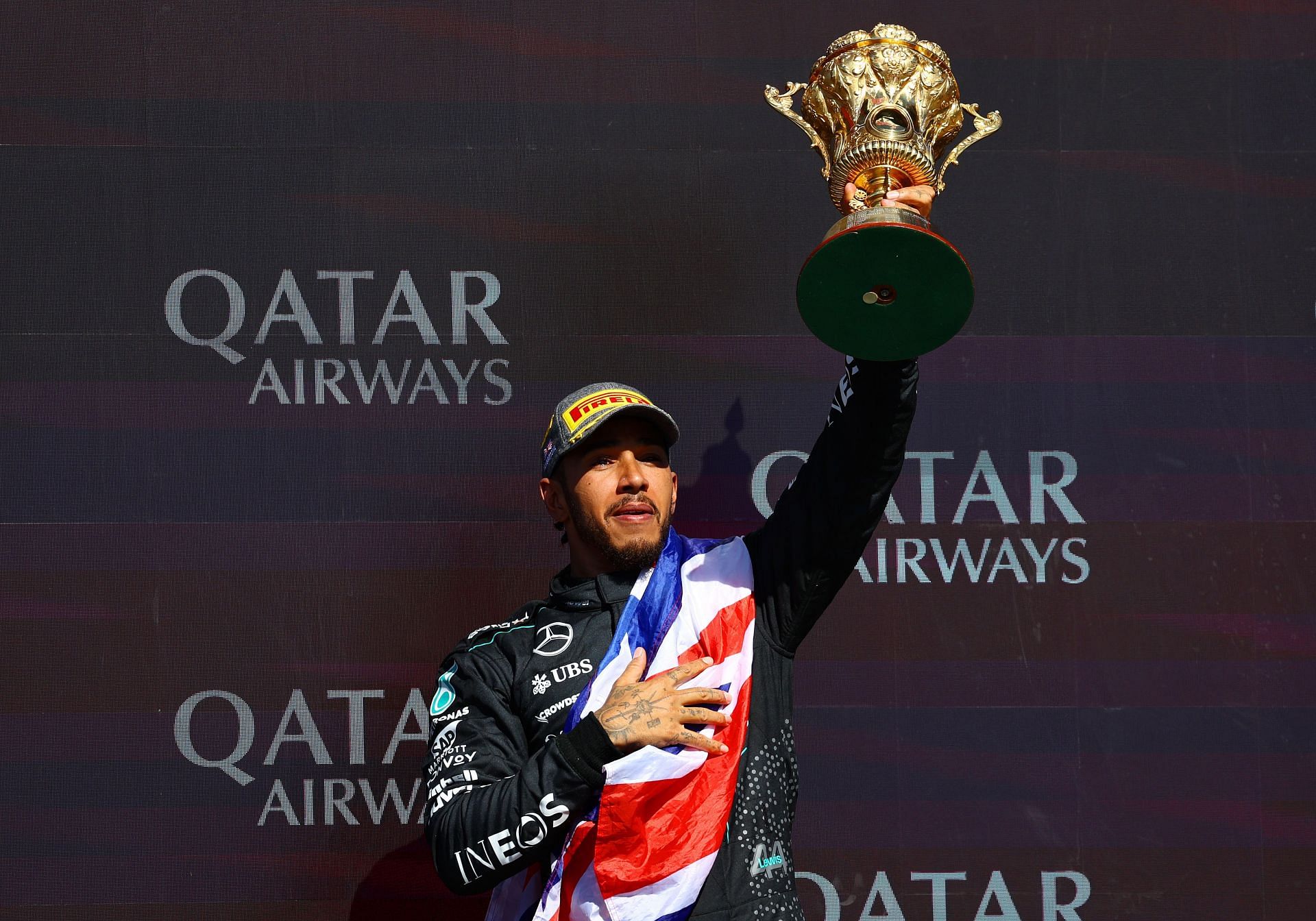 Race winner Lewis Hamilton of Great Britain and Mercedes celebrates on the podium during the F1 Grand Prix of Great Britain at Silverstone Circuit on July 07, 2024 in Northampton, England. (Photo by Mark Thompson/Getty Images)