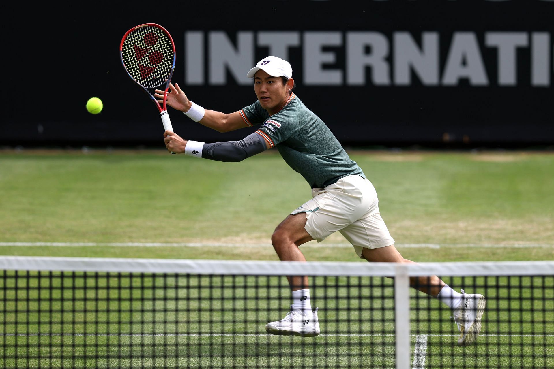 Yoshihito Nishioka plays a volley