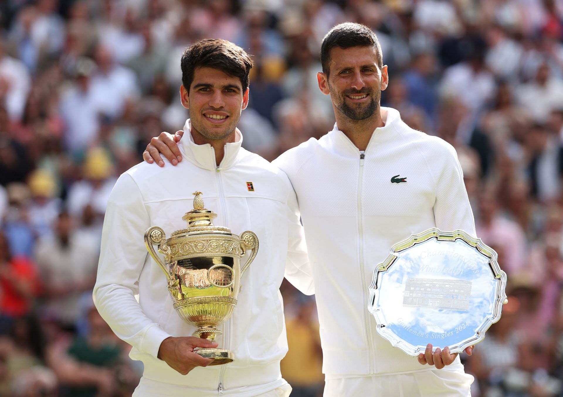 Carlos Alcaraz (L) and Novak Djokovic (R) after the trophy presentation ceremony of the 2024 Wimbledon Championships men&#039;s singles final (Source: Getty)