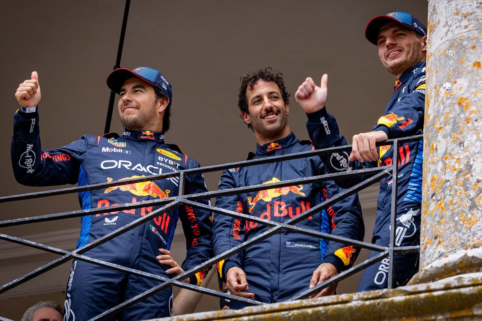 <a href='https://www.sportskeeda.com/player/sergio-perez' target='_blank' rel='noopener noreferrer'>Sergio Perez</a> of Mexico and Oracle Red Bull Racing,Daniel Ricciardo of Australia and Oracle Red Bull Racing and Max Verstappen of the Netherlands and Oracle Red Bull Racing acknowledge fans during day 4 of the Goodwood Festival of Speed at Goodwood on July 14, 2024 in Chichester, England. (Photo by Bob McCaffrey/Getty Images)