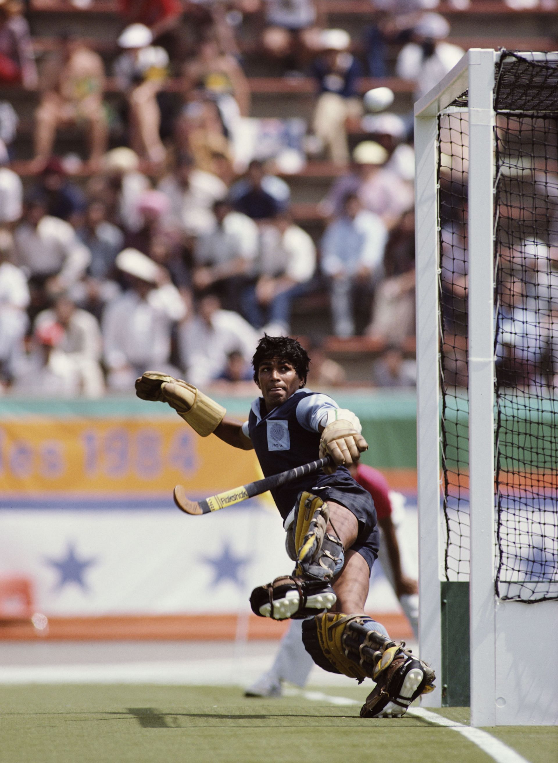 Indian Goalkeeper Romeo James attempts a save during the field hockey team's loss against Australia at the 1984 Los Angeles Olympics. (Image via Getty)