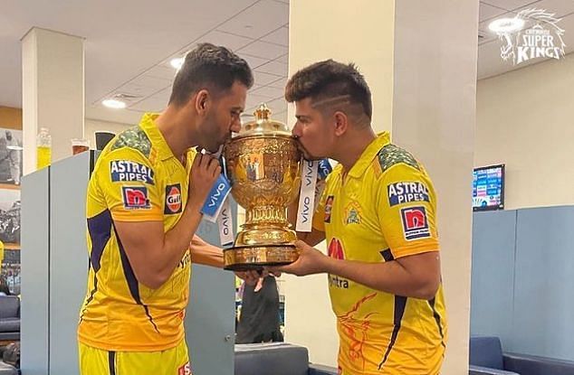 Karn Sharma with his Chennai Super Kings teammate Deepak Chahar after winning the IPL 2021 trophy (Image Credits: Karn Sharma&#039;s Instagram)